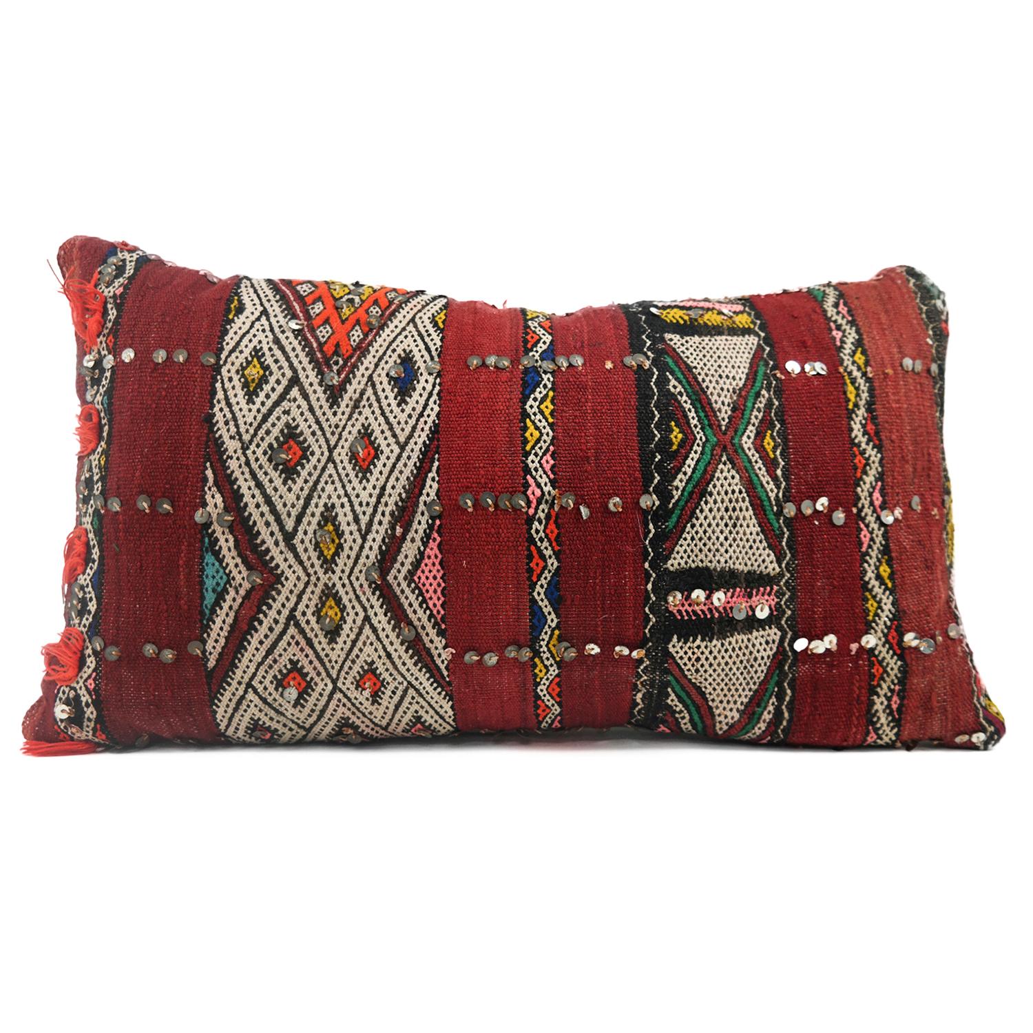 A stunning extra large Bohemian Moroccan Kilim cushion custom made in Morocco. Cut from a circa 40 years old hand loomed kilim rug, from the Middle Atlas Mountains. We have searched and selected the rug ourselves. The pillow has beautiful colors