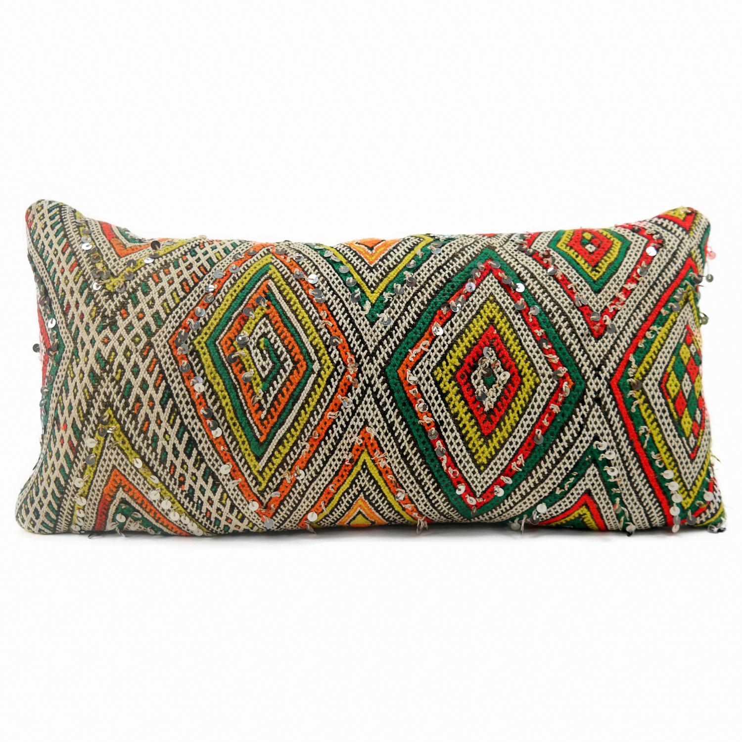 A stunning XL Bohemian Moroccan Kilim cushion custom made in Morocco. Cut from a circa 40 years old hand loomed Kilim rug, from the Middle Atlas Mountains. We have searched and selected the rug ourselves. The pillow has beautiful colors like yellow,