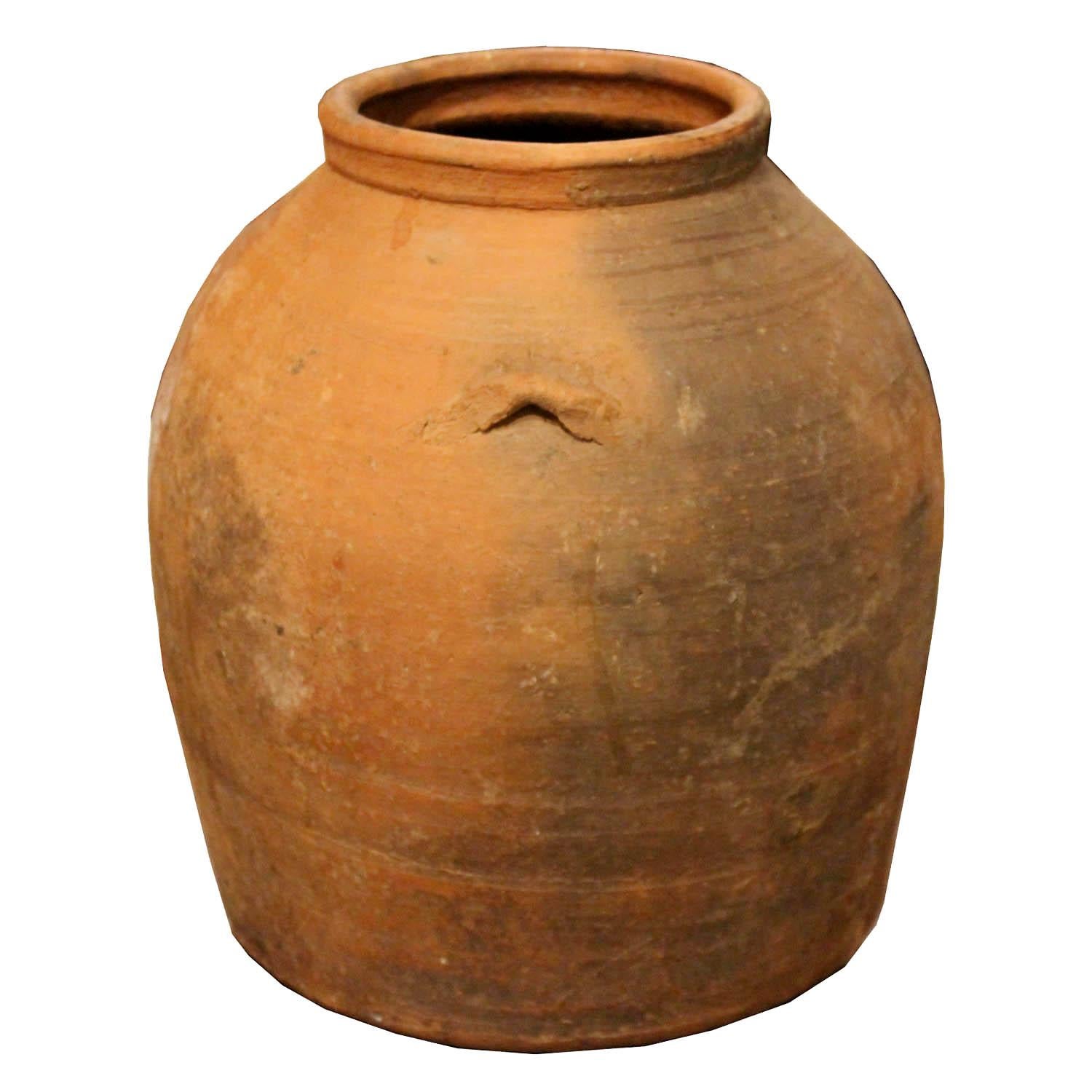 Vintage Moroccan clay pot was originally used for storing water. Can be placed on a bookshelf or coffee table for an earthy accessory.