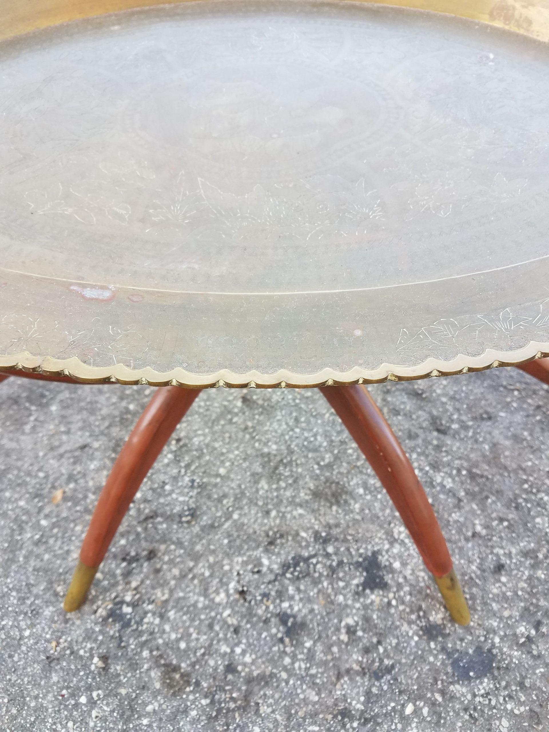 One of a kind Moroccan copper tray table, ideal as a coffee table or a side table. Very exotic. Oval shape and an amazing look. With its detailed copper hammering on top, this table will sure be a excellent add-on to your home or office decor. It