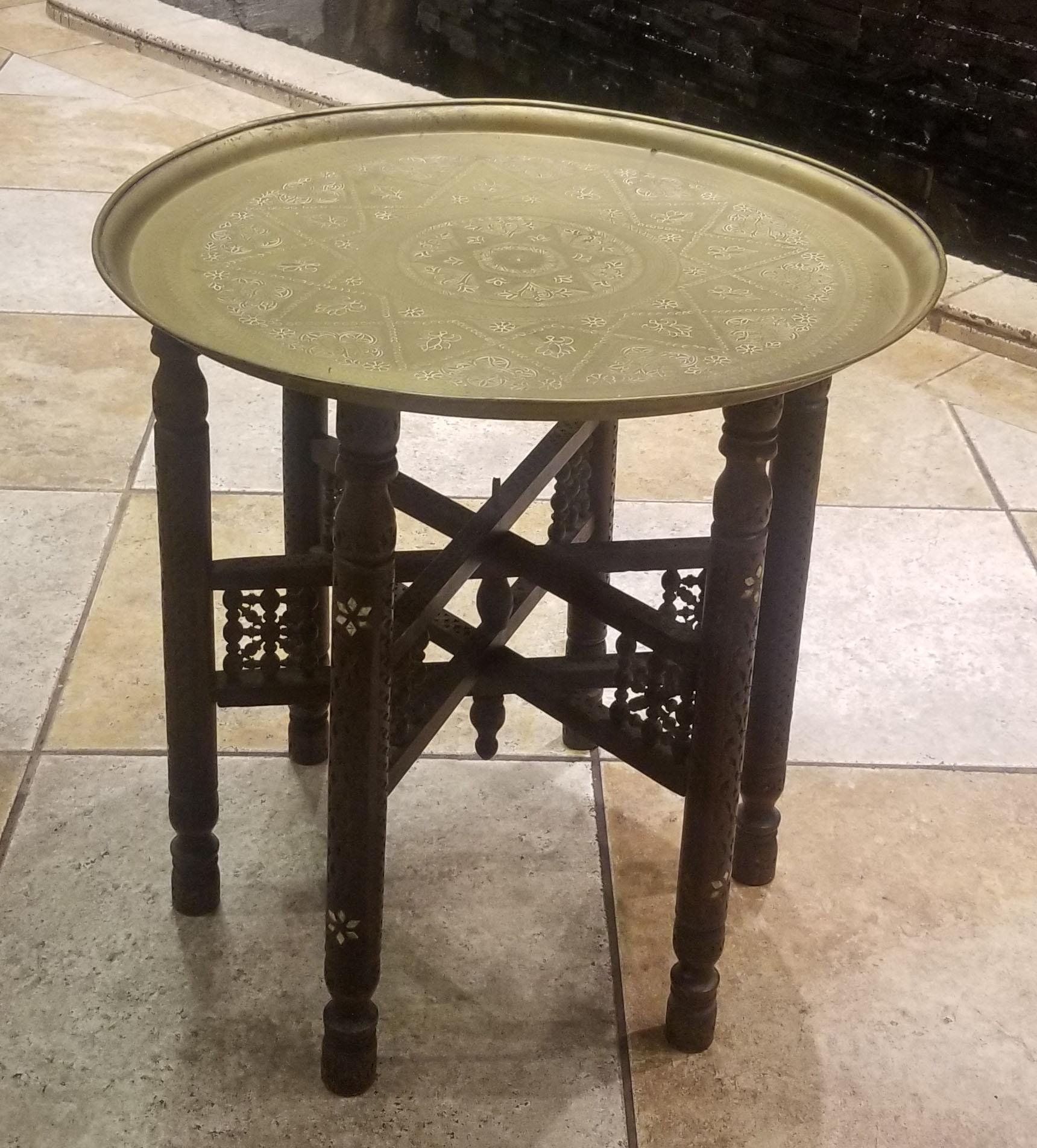 One of a kind Moroccan copper tray table, ideal as a coffee table or a side table. Very exotic. Round shape and an amazing look. Description
Influenced by Moorish decor, its detailed copper hammering on top, this table will sure be an excellent