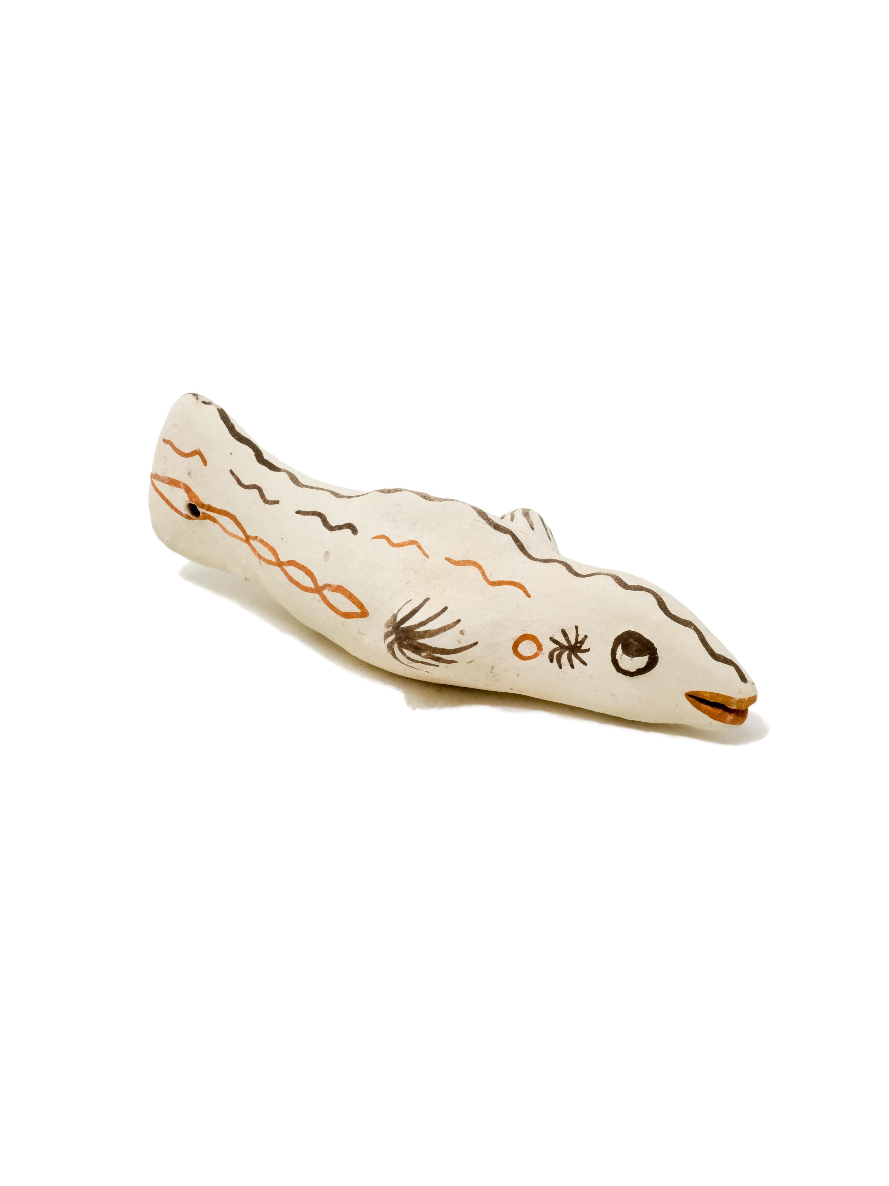 - Hand built decorative fish sculpture
- made of clay collected from the potter's surroundings.
- decorative motifs painted with a goat hair brush made by the potter to apply natural pigments.
- made in the Moroccan Rif mountains by