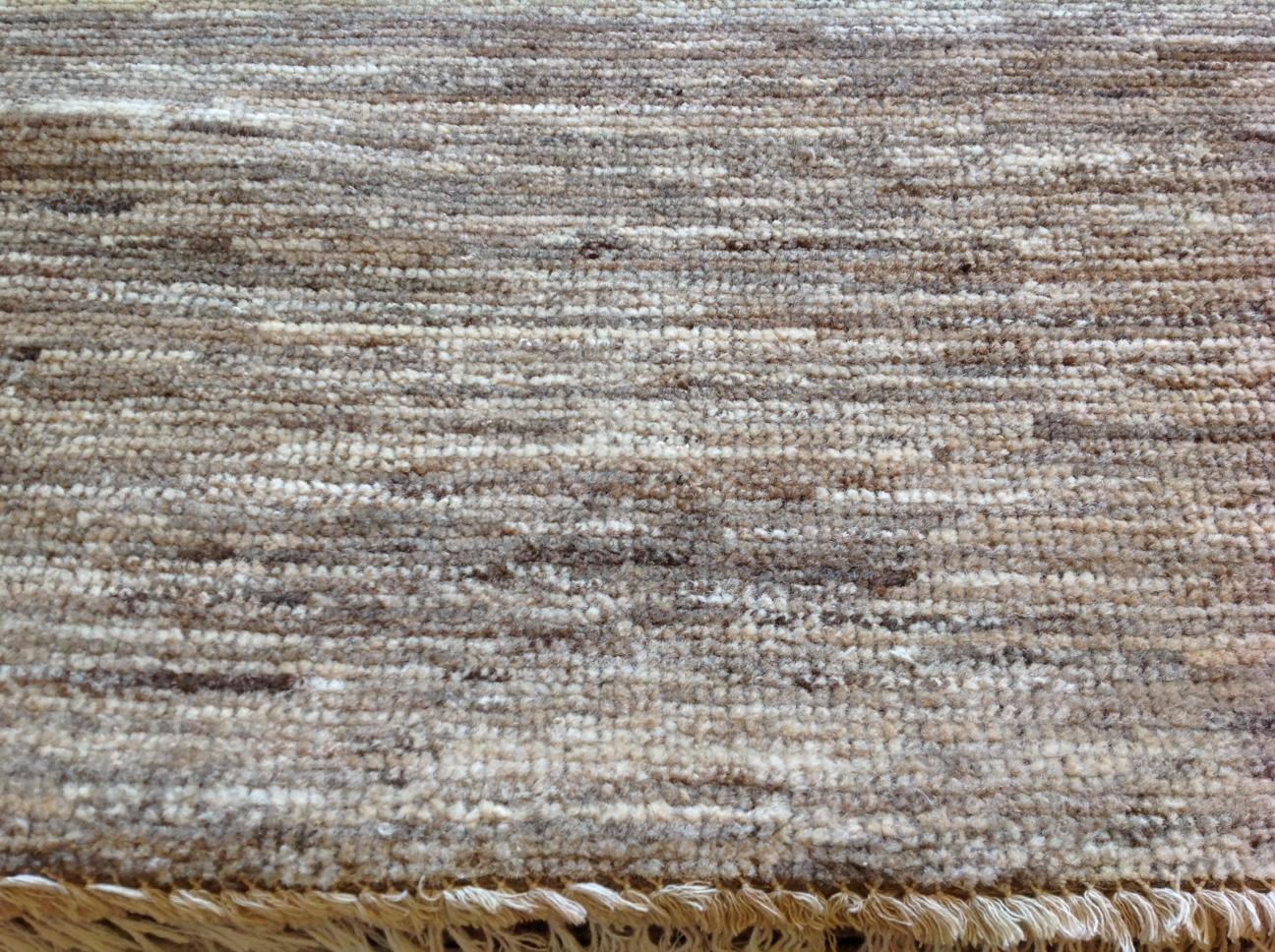 Natural brown striated rug.