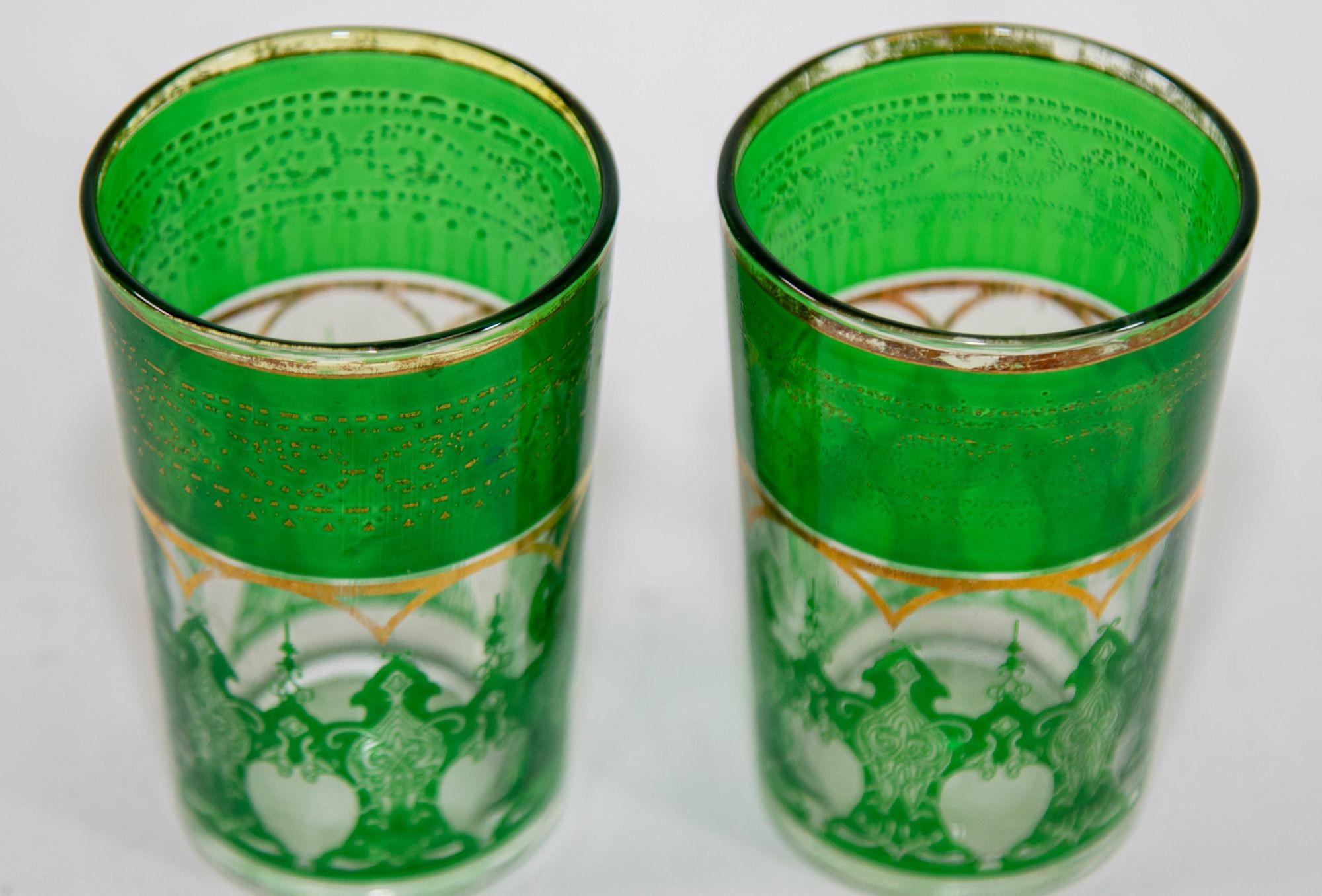 Moroccan Drinking Glasses Set of 2 with Moorish Design Vintage Barware.
Set of two Moroccan emerald green glasses with gold raised Moorish design.
Decorated with a classical gold and pattern Moorish frieze.
Use these elegant vintage glasses for