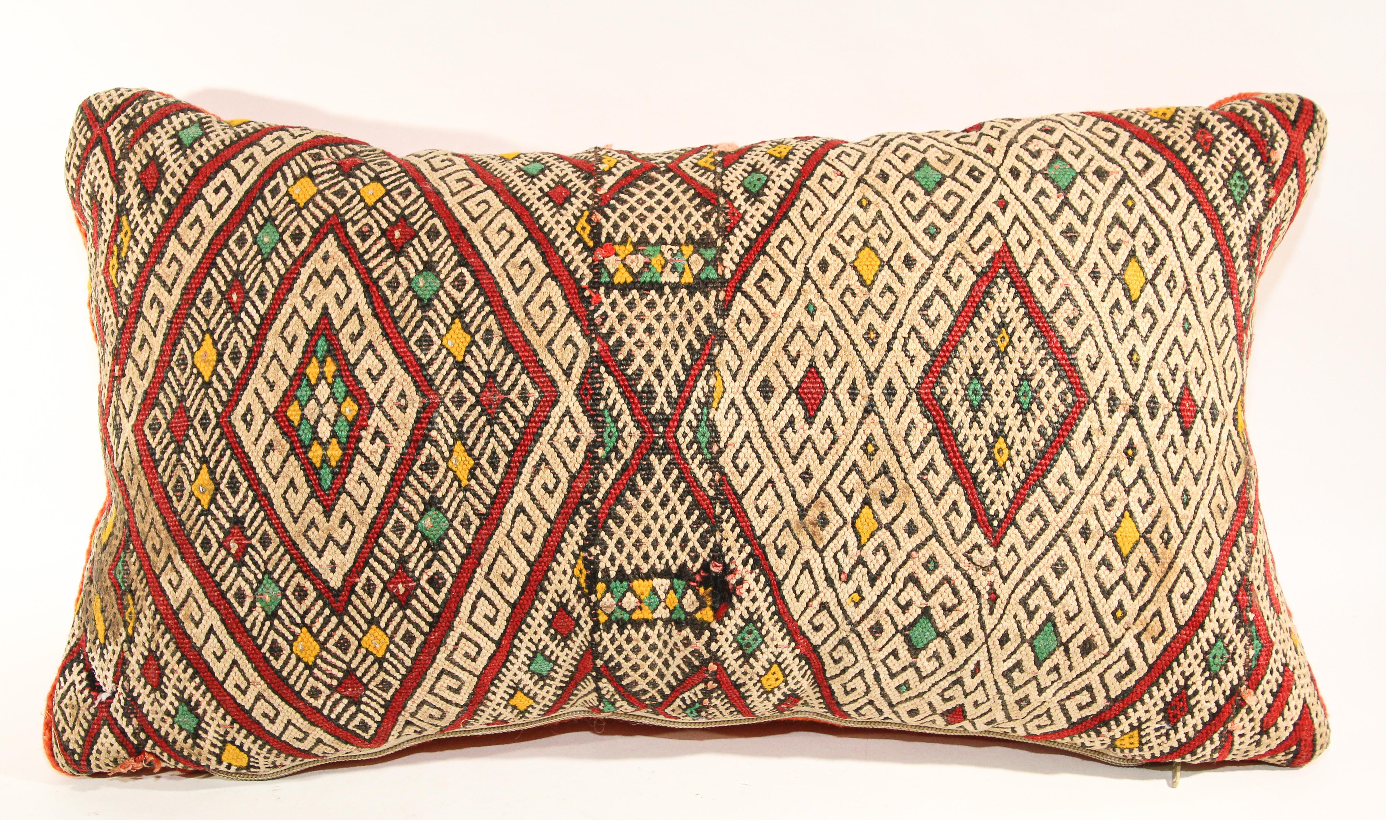 Moroccan authentic Berber ethnic handwoven tribal throw pillow made from a vintage rug.The front and the back are made from a different rug, front is more elaborate and back is more plain.Geometric North African tribal designs in red, white and