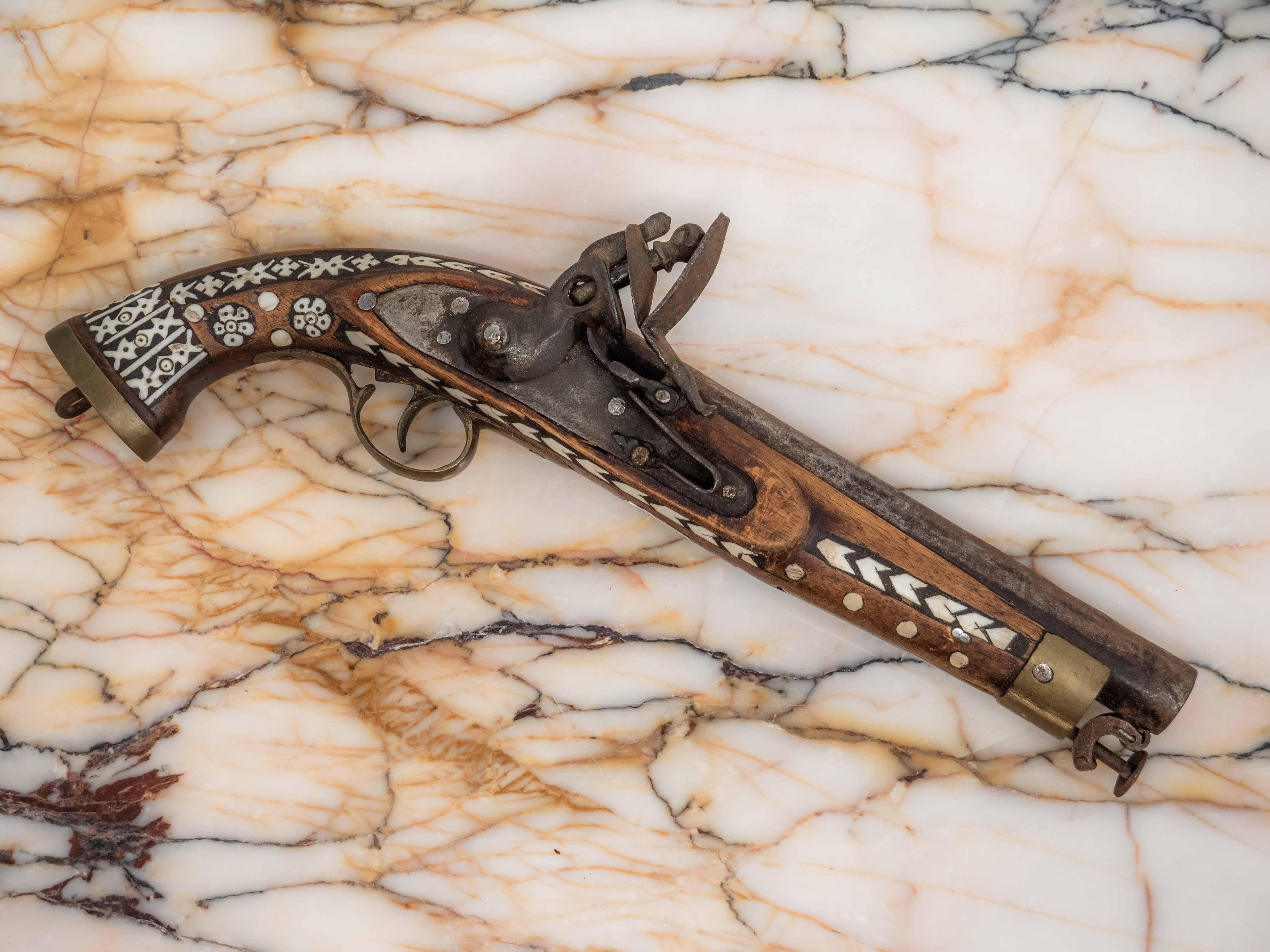 Moroccan flintlock pistol from the 19th century

This weapon is probably of North African or Middle Eastern origin, specifically from Morocco or Afghanistan. The weapon is a 19th century flintlock pistol that is inlaid with bone, a characteristic of