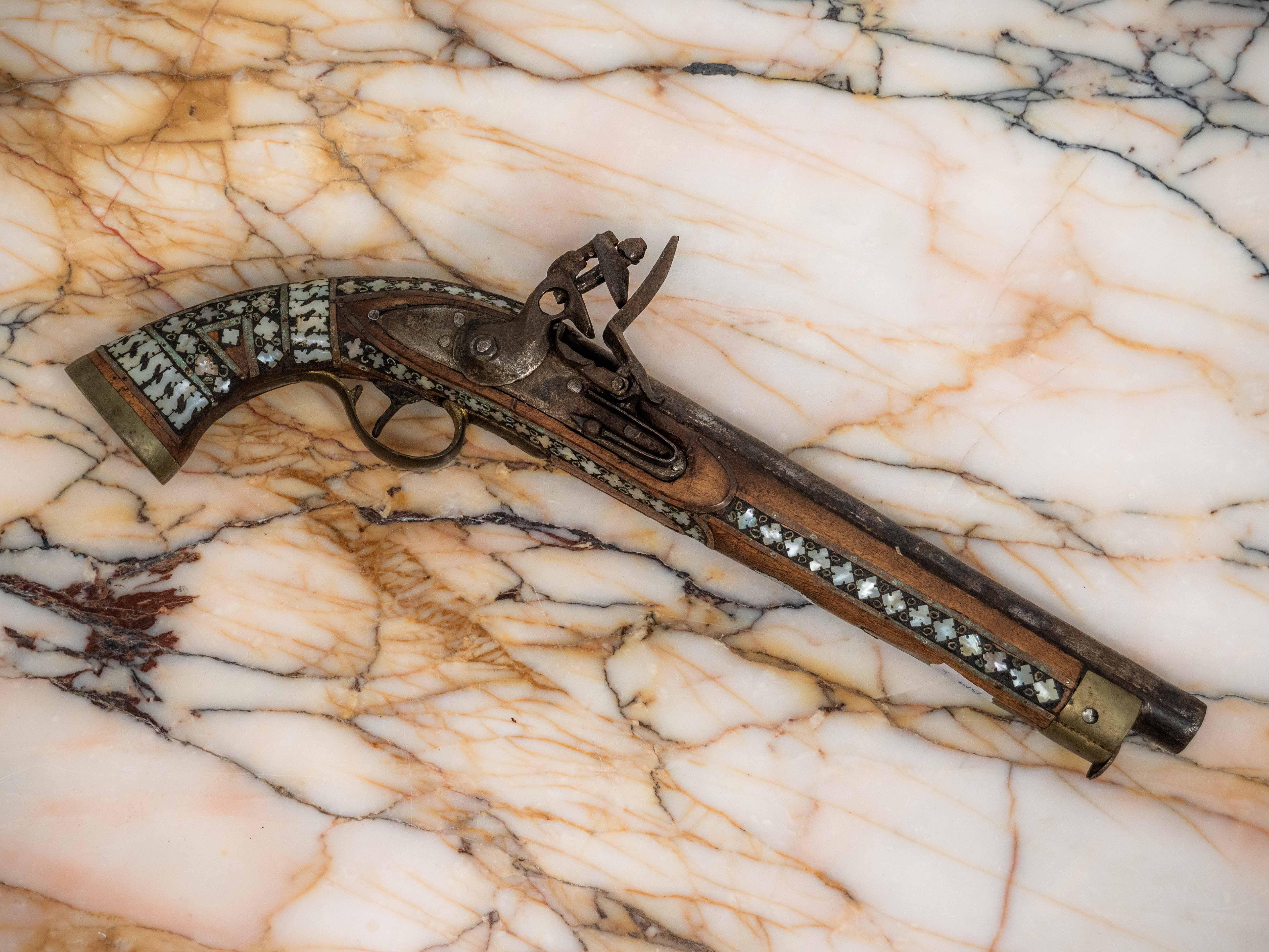 Moroccan flintlock pistol from the 19th century

This weapon is probably of North African or Middle Eastern origin, specifically from Morocco or Afghanistan. The weapon is a 19th century flintlock pistol that is inlaid with bone, a characteristic of