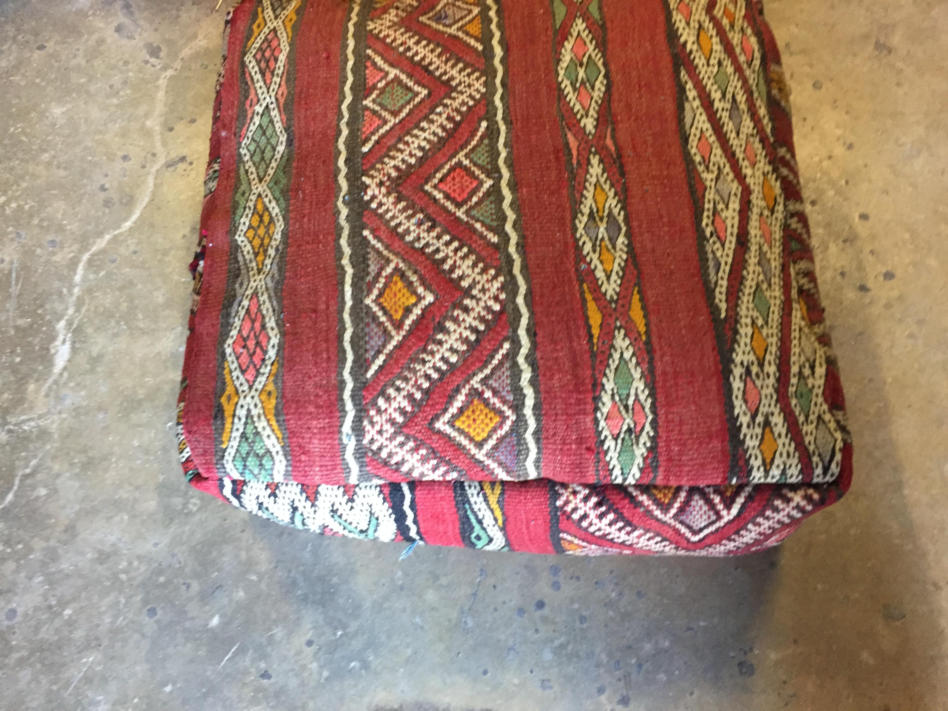 Moroccan vintage floor pillow seat cushion made from a Tribal Berber rug.
Square shape with nice faded earth tone colors for the top and rich warm stripes colors for the bottom.
Great addition for any Bohemian or Modern interior.
Made from a