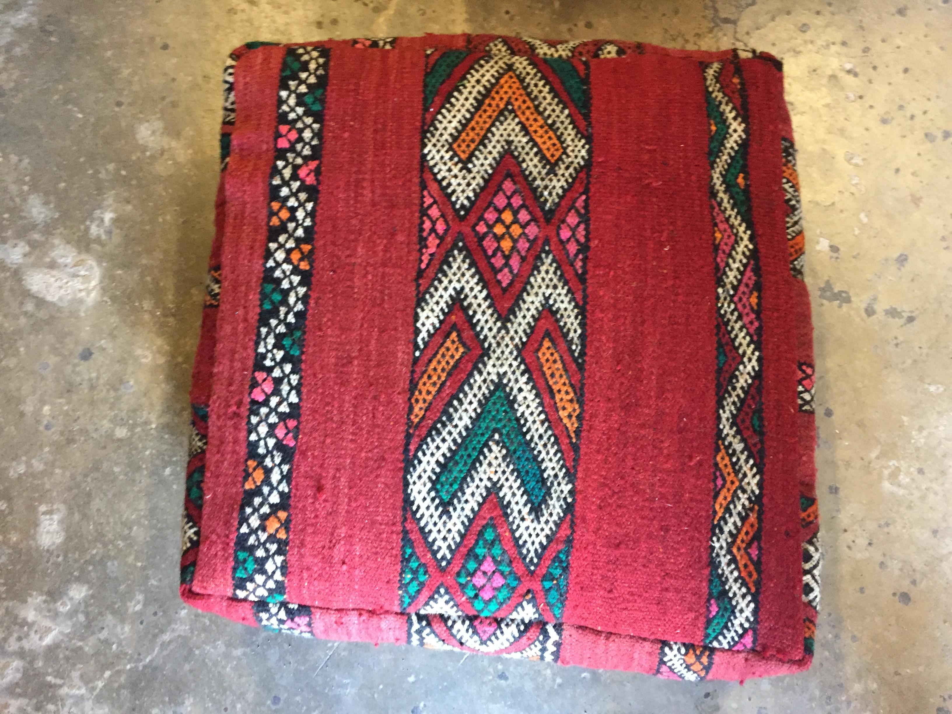 Moroccan vintage floor pillow seat cushion made from a Tribal Berber rug.
Square shape with nice faded earth tone colors for the top and rich warm stripes colors for the bottom.
Great addition for any Bohemian or modern interior.
Made from a