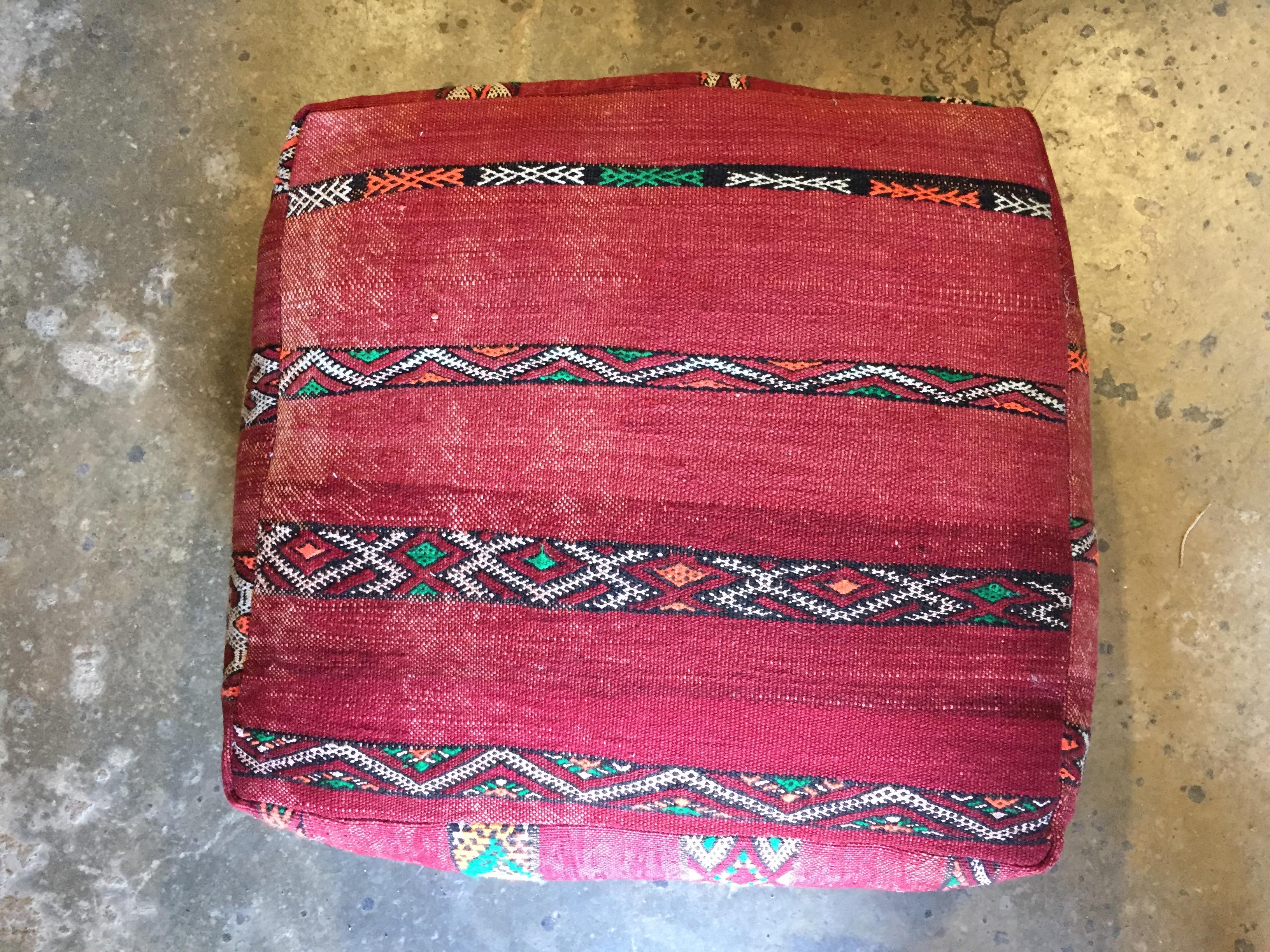 Moroccan vintage floor pillow seat cushion made from a Tribal Berber rug.
Square shape with nice faded earth tone colors for the top and rich warm stripes colors for the bottom.
Great addition for any Bohemian or Modern interior.
Made from a
