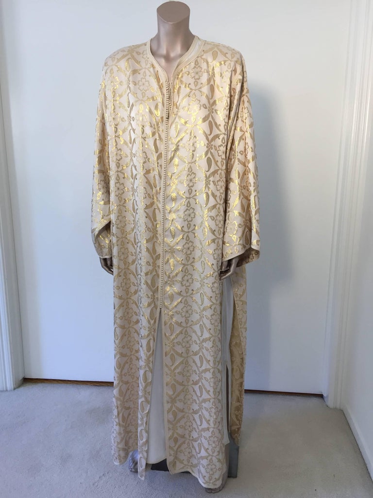 Elegant Moroccan caftan silk brocade white and gold silk embroidered.
This is a set of two dresses that you can wear together or separate,
circa 1980s.
This long maxi dress set kaftan is embroidered and embellished entirely by hand.
One of a kind