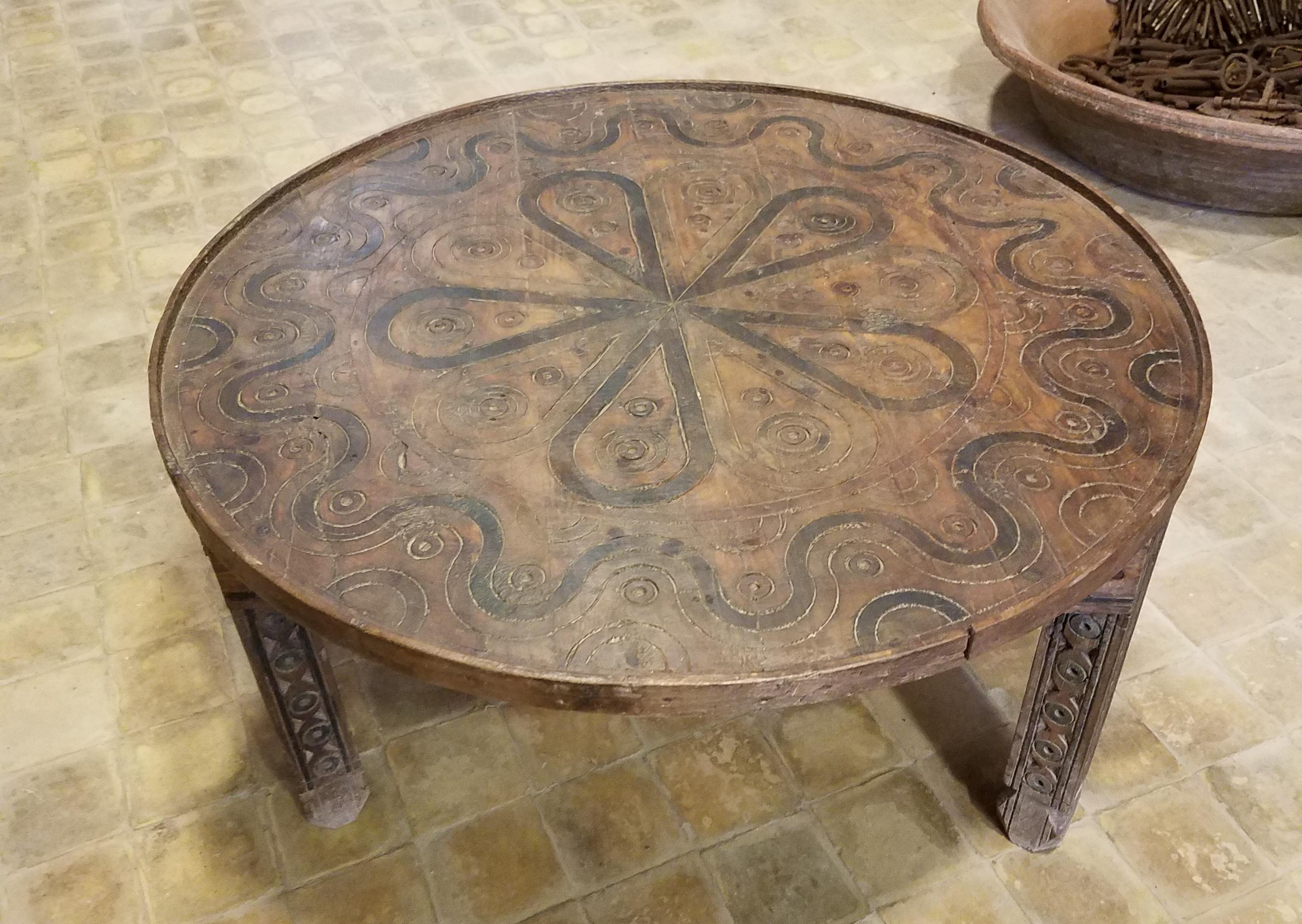 round carved coffee table