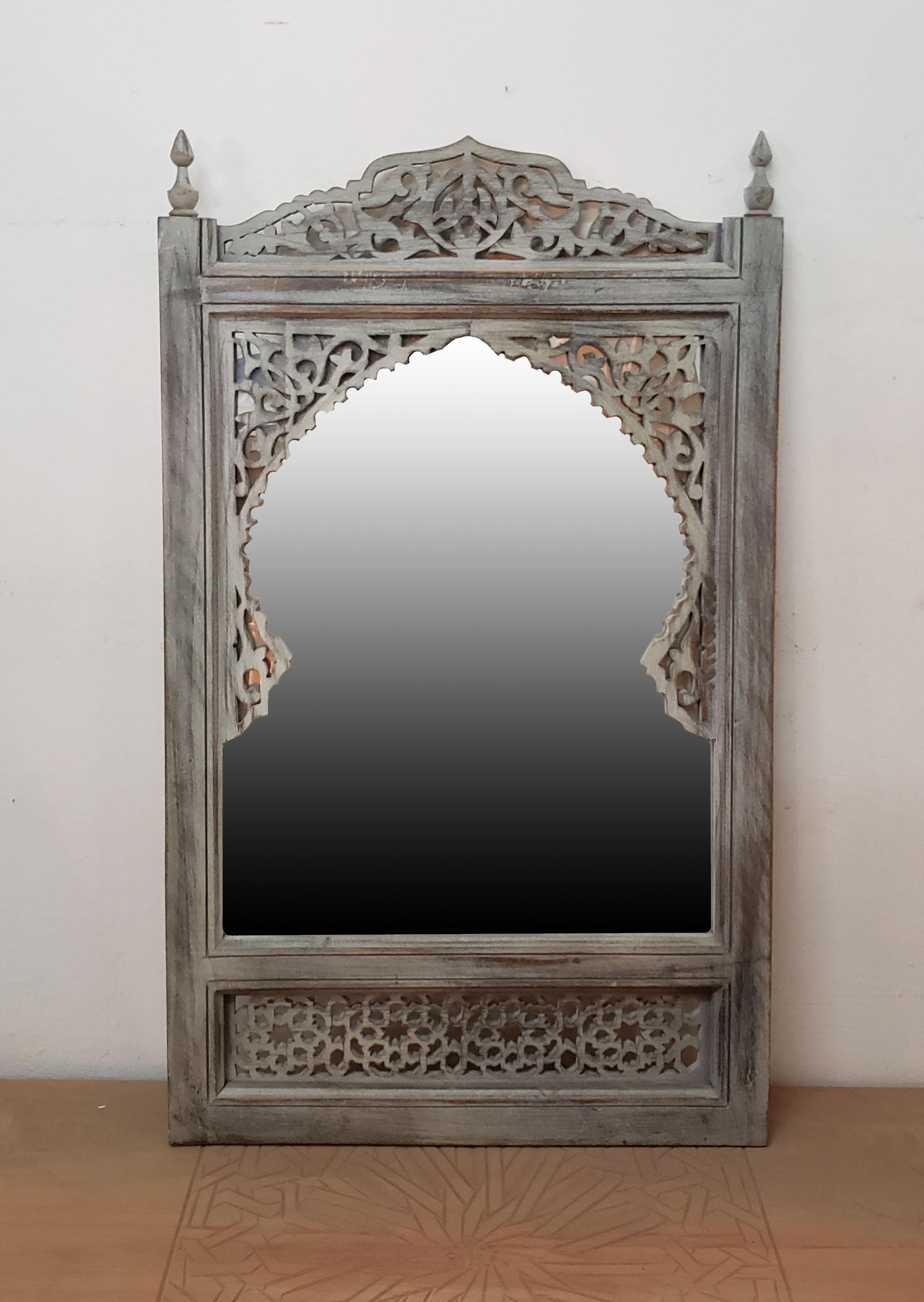 Color: White
Moroccan hand carved cedar wood mirror and frame measuring approximately 30” in height, 18” in width, and 2