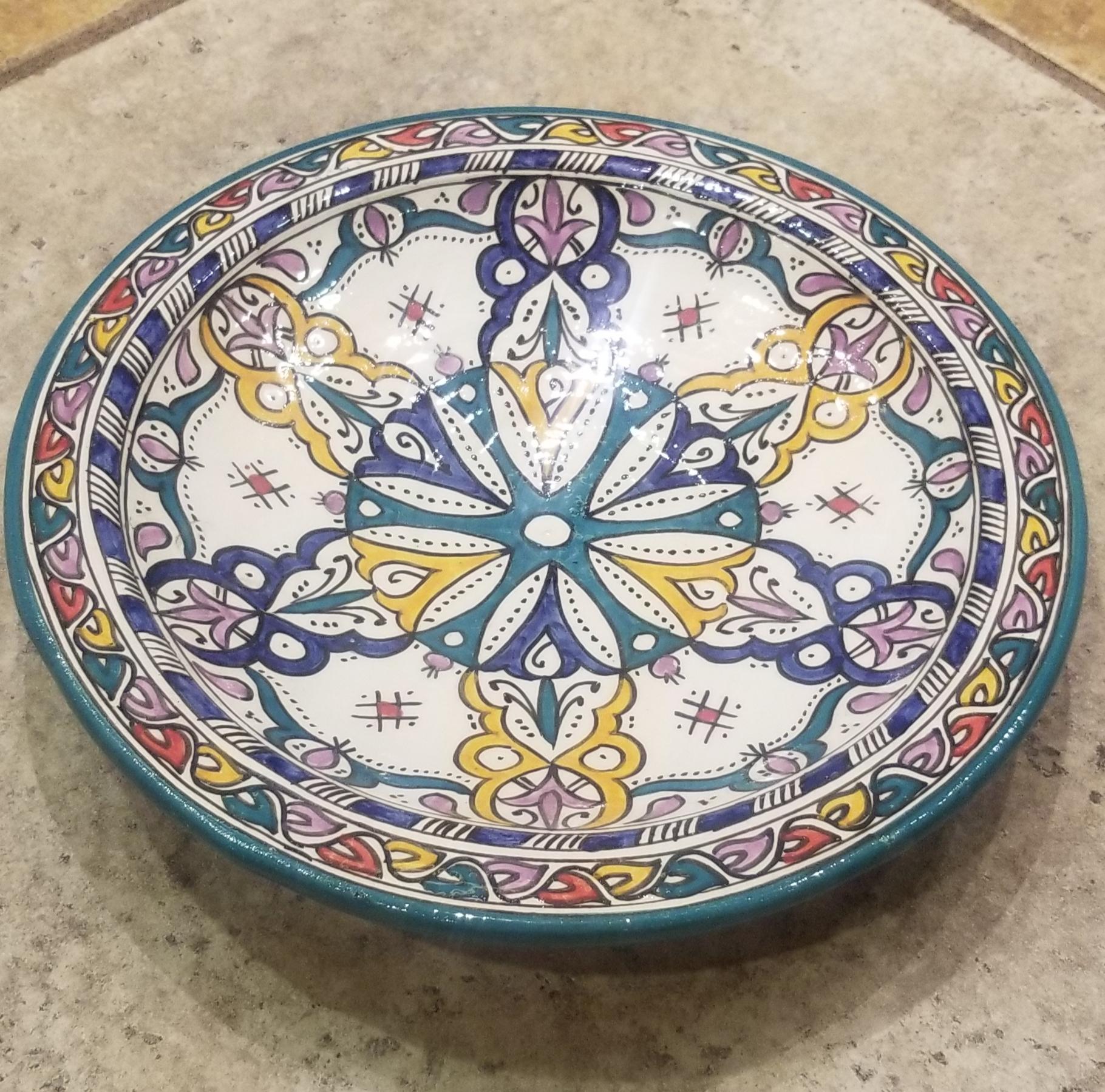 A rare or one of a kind exquisite Moroccan plate / charger not only for decoration purpose, but also to serve amazing food. This plate in hand painted and is multi-color. It would be a terrific add-on to any décor. Great Handcraftsmanship and