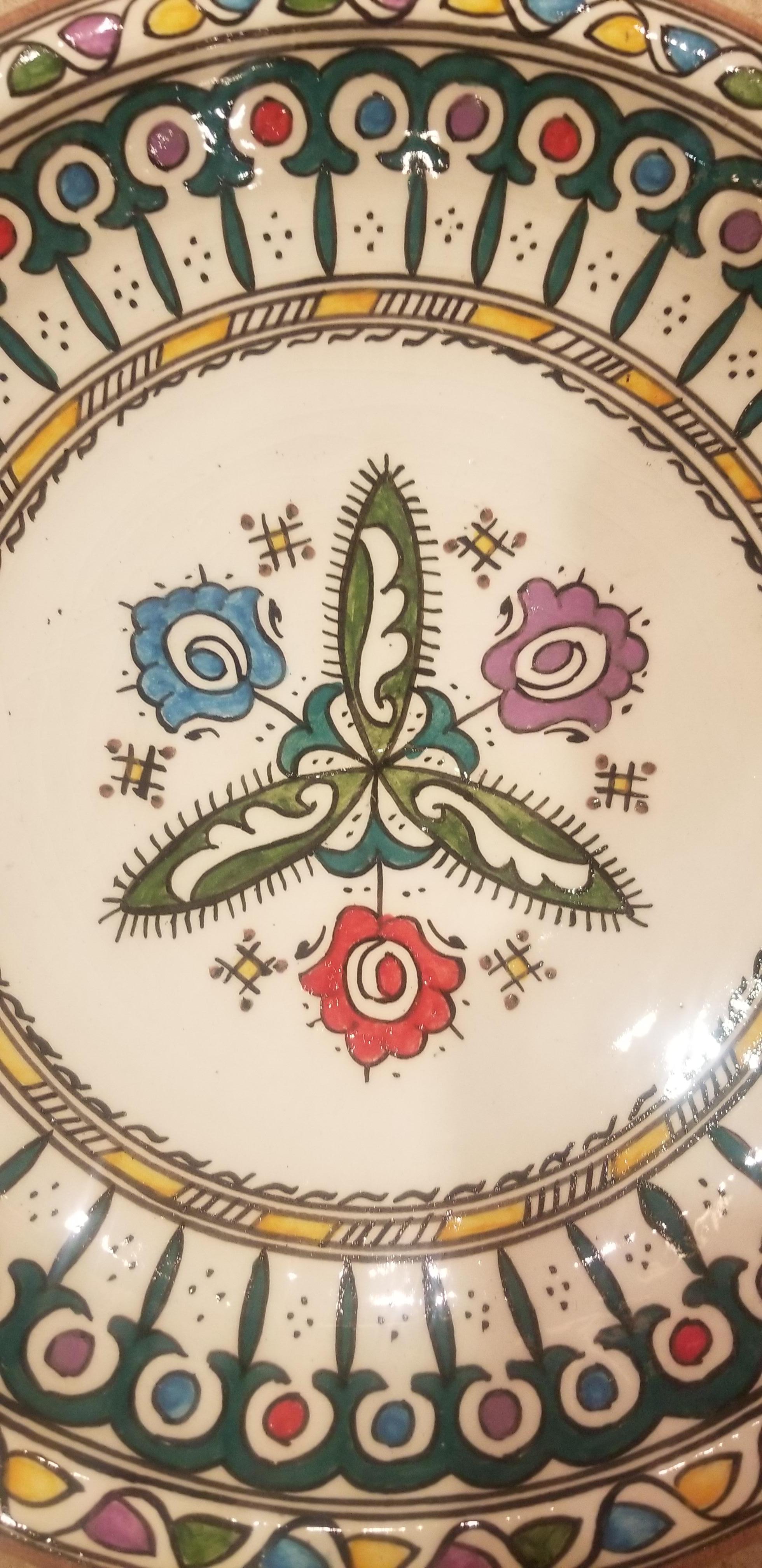 A rare or one of a kind exquisite Moroccan plate / charger not only for decoration purpose, but also to serve amazing food. This plate in hand painted and is multi-color. It would be a terrific add-on to any decor. Great Handcraftsmanship and