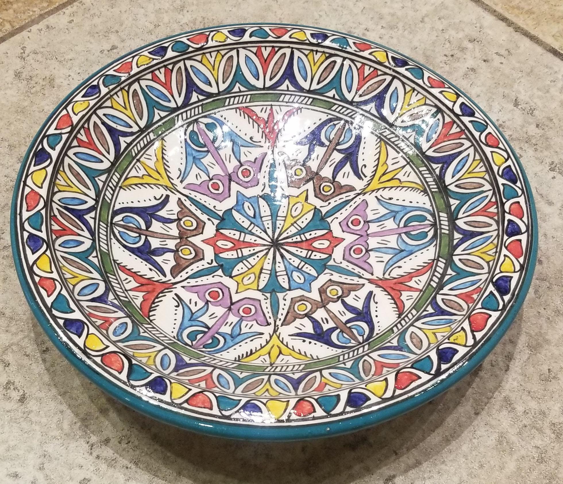 A rare or one of a kind exquisite Moroccan plate / charger not only for decoration purpose, but also to serve amazing food. This plate in hand painted and is multi-color. It would be a terrific add-on to any décor. Great Handcraftsmanship and