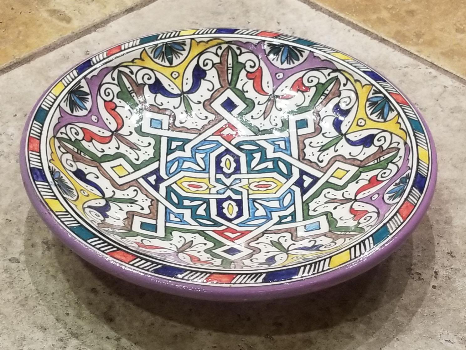 A rare or one of a kind exquisite Moroccan plate / charger not only for decoration purpose, but also to serve amazing food. This plate in hand painted and is multi-color. It would be a terrific add-on to any decor. Great Handcraftsmanship and