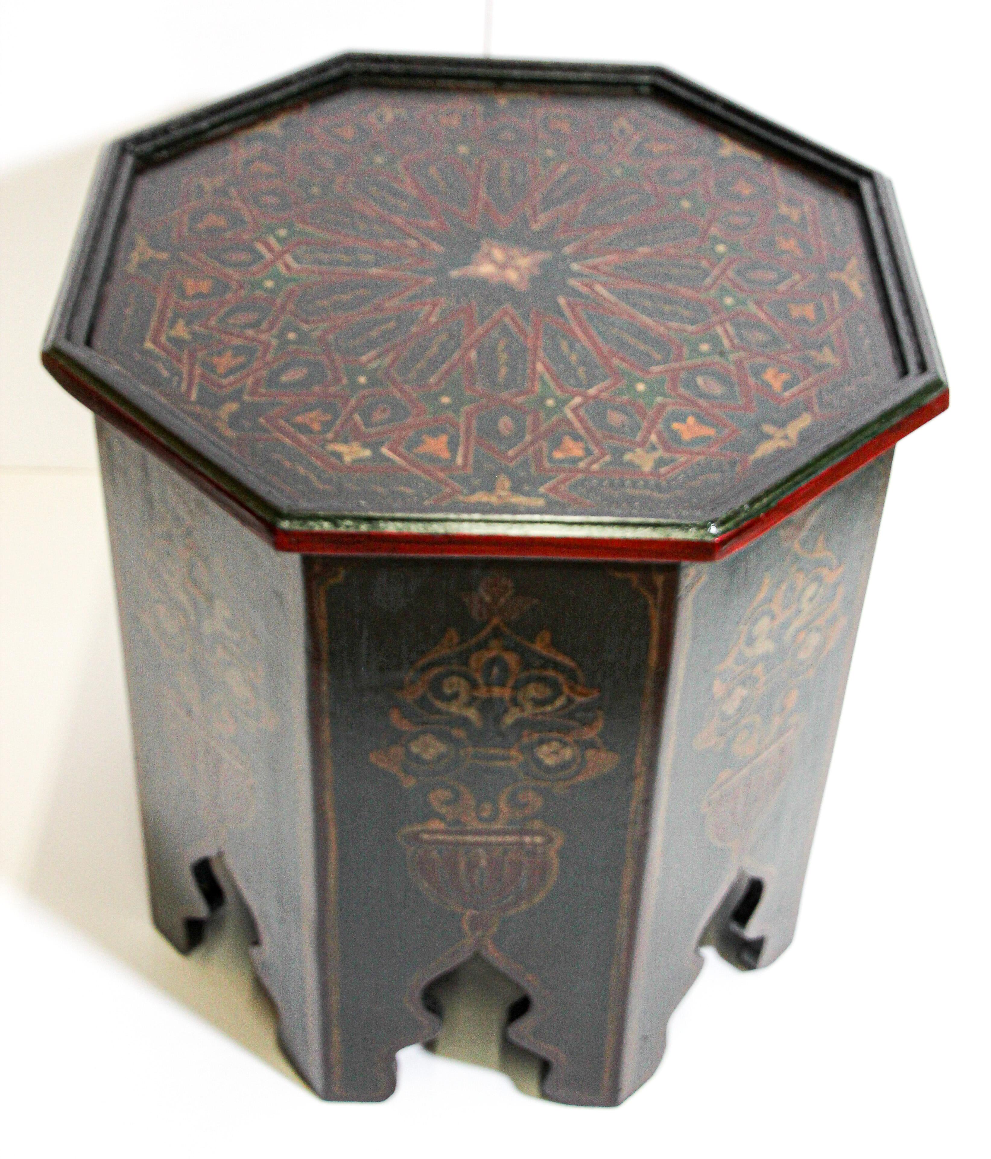 Moroccan hand painted side table with Moorish designs cut out work on sides.
Very fine wood artwork on an octagonal shape with Moorish arches on base floral designs on the sides and geometric on top.
You can use this Moroccan accent table as