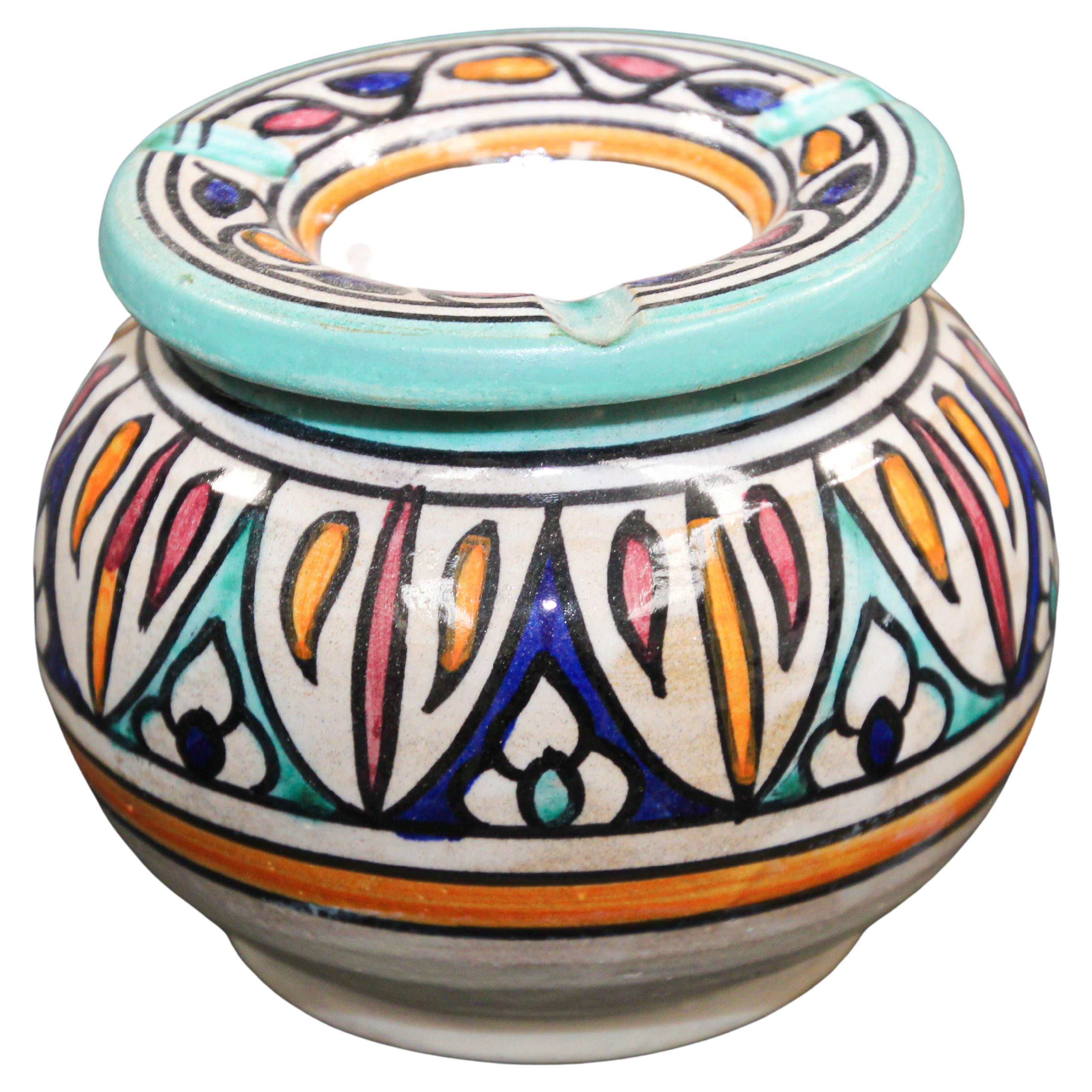 Vintage Moroccan covered hand painted ceramic ashtray.
Handcrafted Moroccan ceramic covered ash receiver.
This covered medium size ashtray could be used indoor and outdoor.
If used indoor the cover will keep the smell of ashes in.
Hand painted