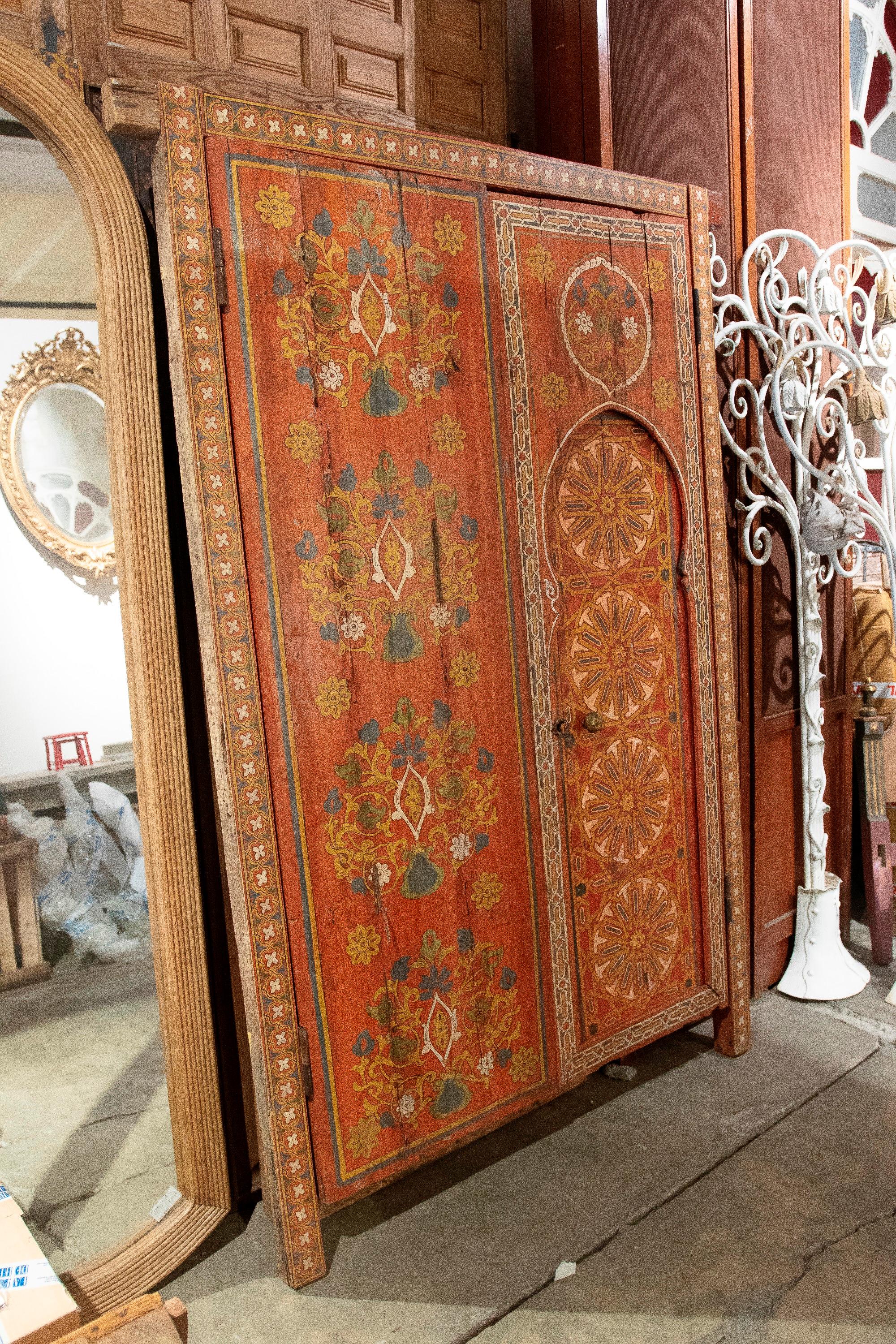20th Century Moroccan Hand-Painted Wooden Door with Flower and Geometric Decoration For Sale