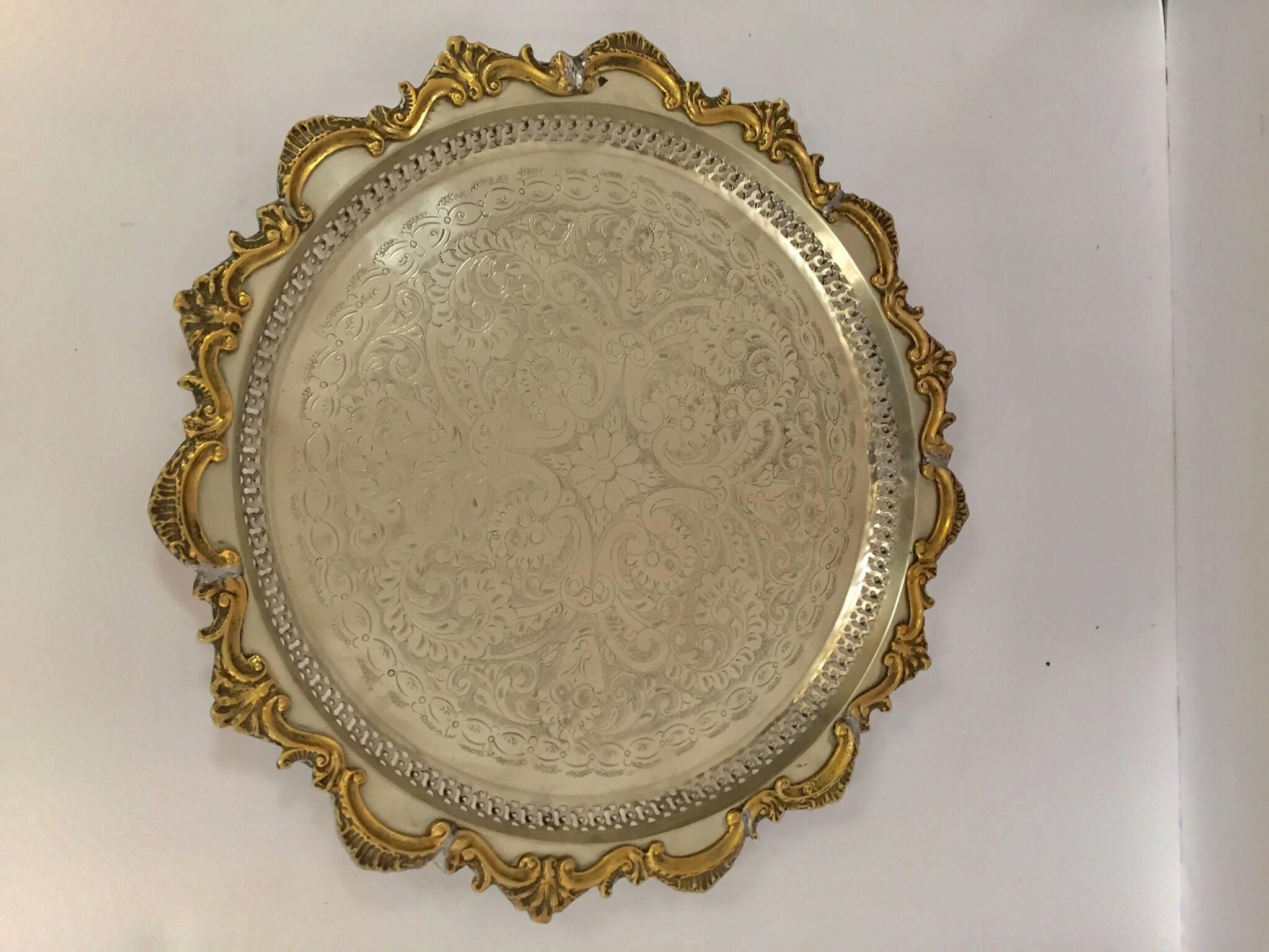 Gorgeous hand chased silver plated large Moroccan round serving tray.
Hand-carved amazing Moorish etching motif and silver finish with brass floral design on the trim.
George V style. Signed and numbered, handcrafted by Master Artisan Benani in