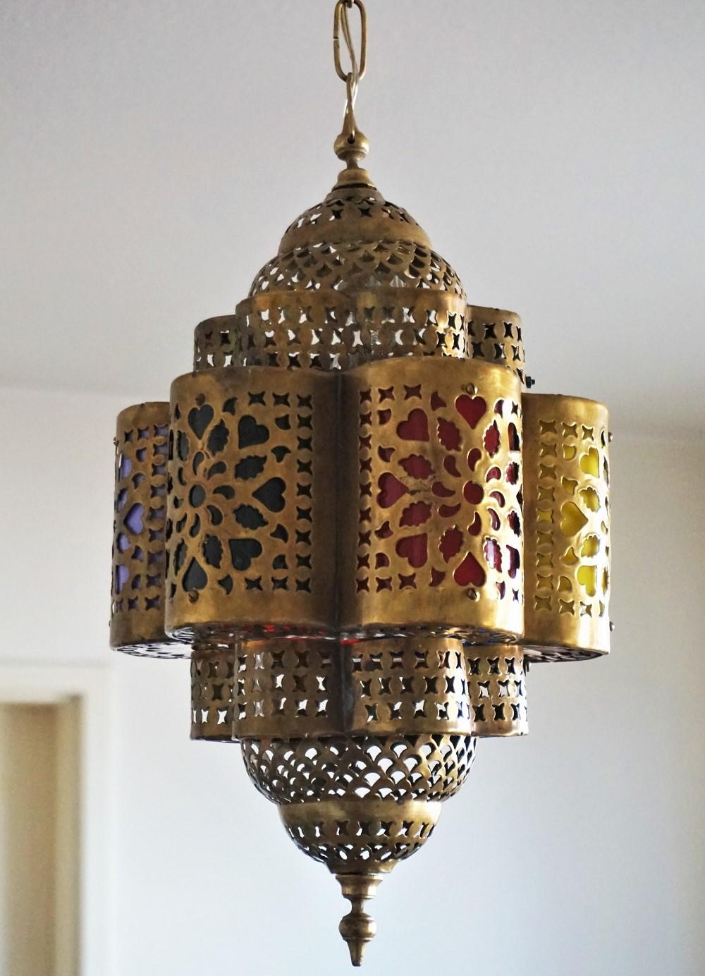 Moroccan handcrafted hexagonal pierced brass lantern with multi-color Lucite fragments.
One E27 light bulb socket - European wiring
Dimensions:
Total height 33