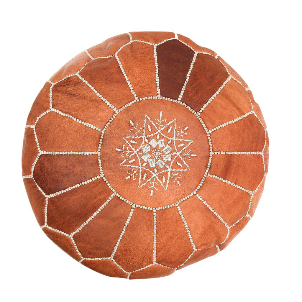 This eye-catching handstitched genuine lamb leather pair of Moroccan Poufs will lend an air of regal majesty to your den or living room. Handcrafted in leather by master artisans and boasting a resplendent arabesque pattern, this pair of poufs is