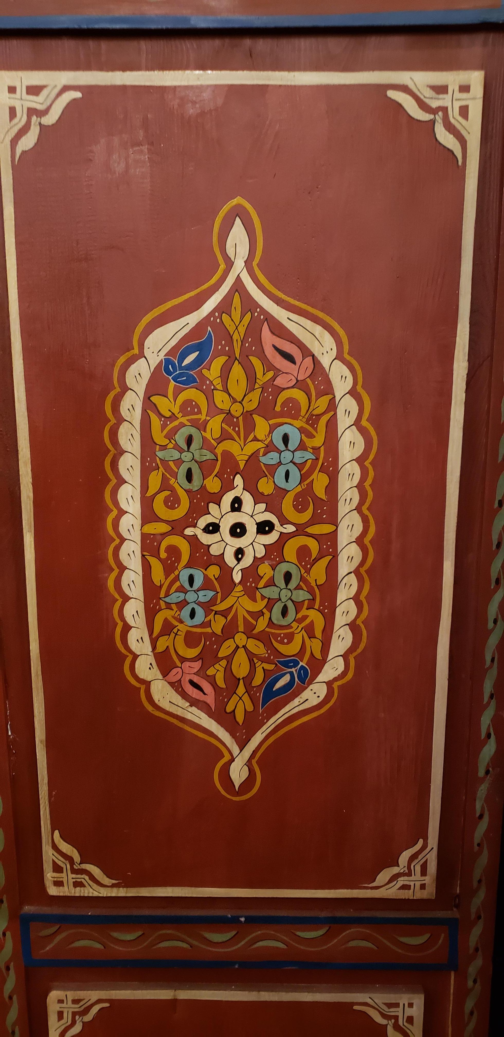 This is a 100% hand painted and hand carved Moroccan wooden armoire made in the city of Marrakech. Great handcraftsmanship throughout, featuring the famous Moroccan Zouak work. Beautiful add-on to your home or office decor. Lots of storage space.