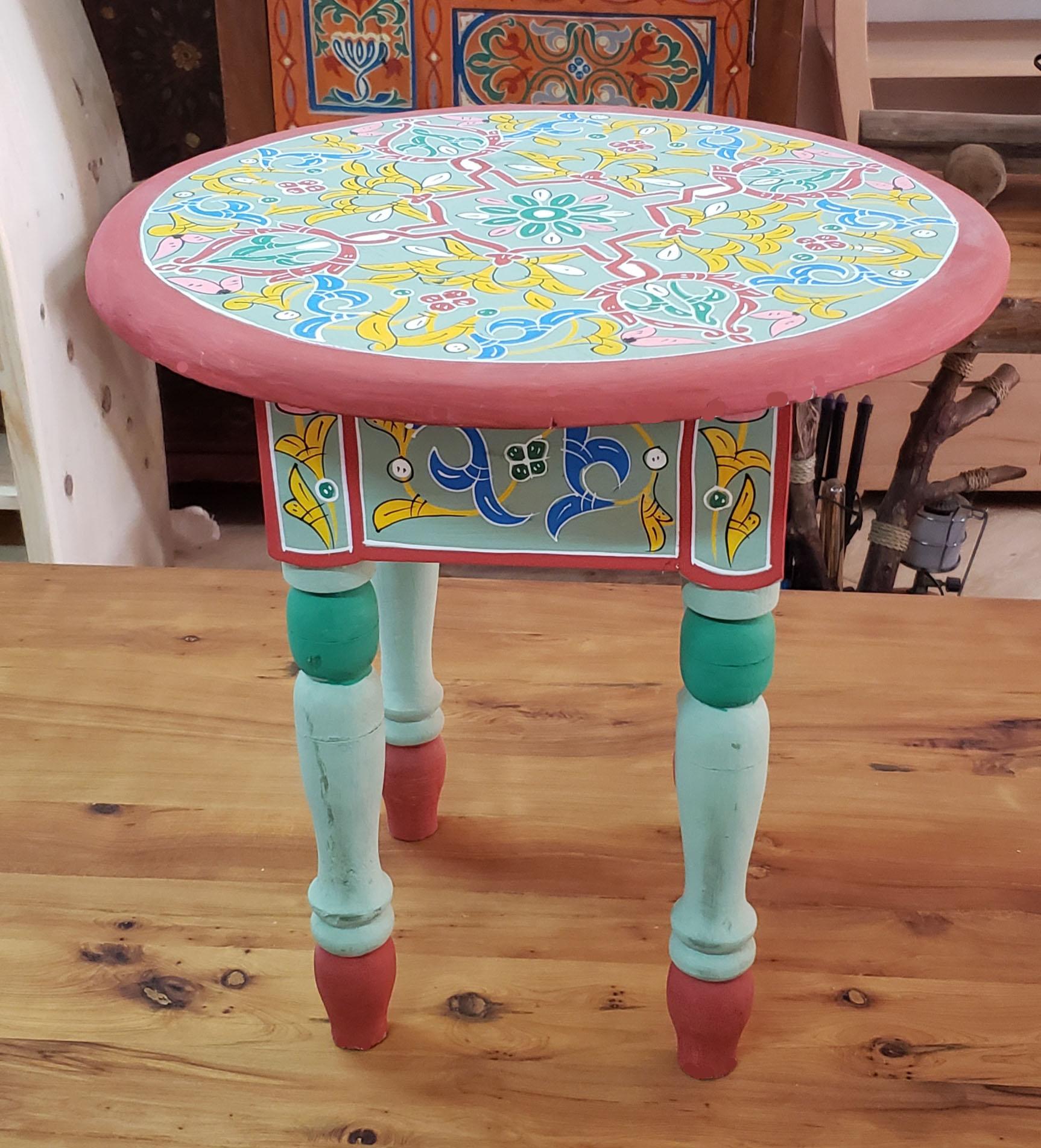 This is a 100% hand painted and hand carved Moroccan round shape side table or end table. Great handcraftsmanship throughout, featuring the famous Moroccan Zouak work. Beautiful add-on to your home or office decor. This table measures approximately