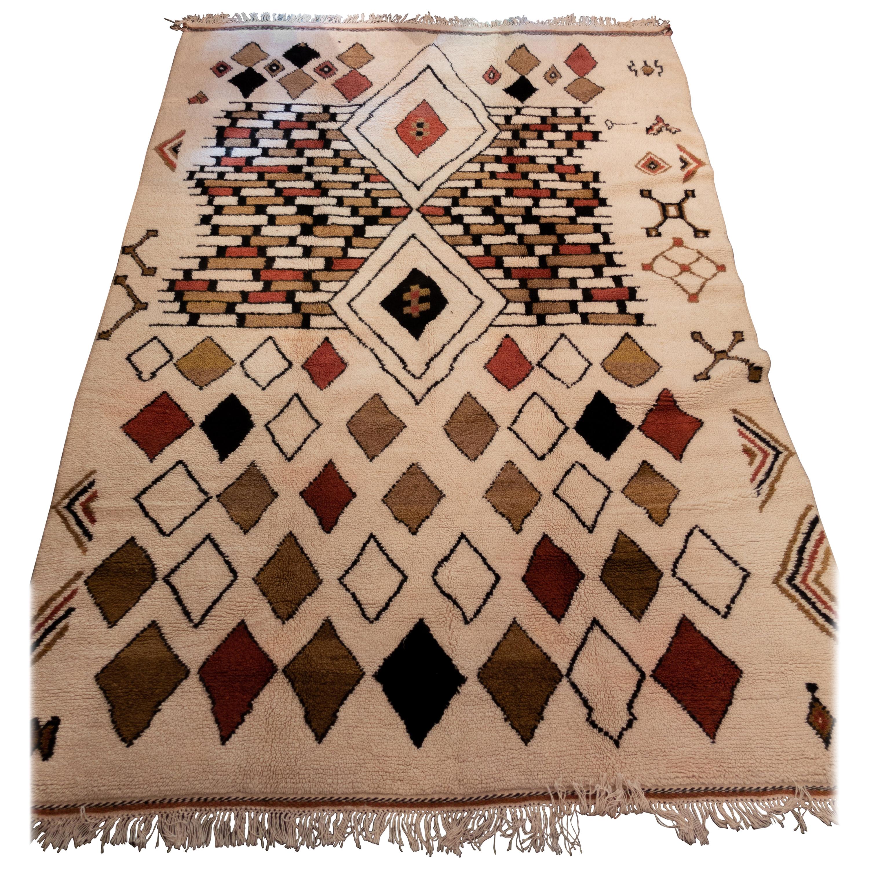 This rug has been traditionally handwoven in one of Morocco’s most remote mountainous villages. This piece reflects the culture, identity, and story of its artisan. This unique contemporary piece with strong colors is handmade with natural craft