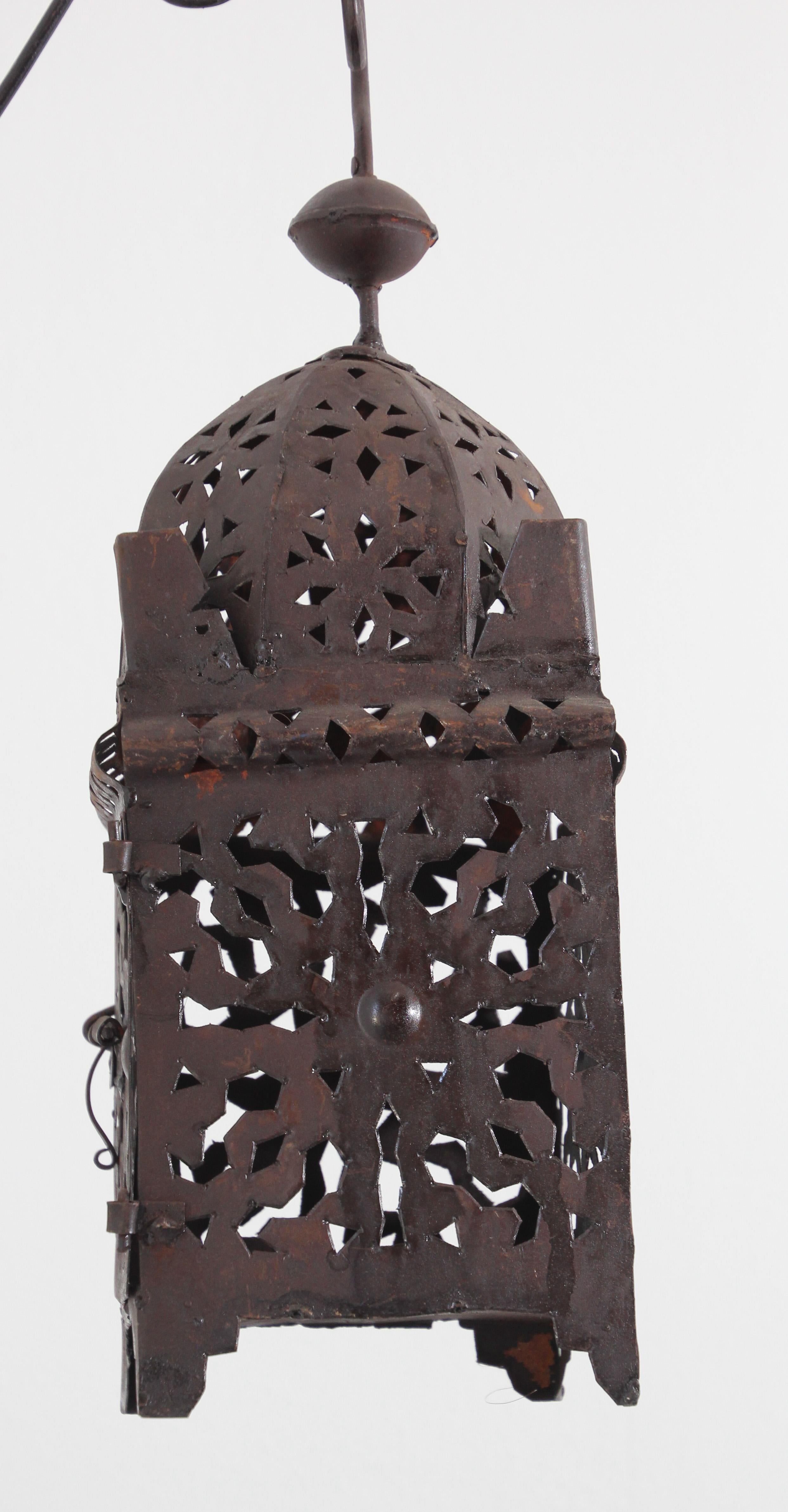 Vintage Moroccan Moorish metal candle lantern with open metal work Moorish design.
Hurricane candle lamp handcrafted in Morocco by artisans, metal hand-cut and hammered with Moorish design, open in front for use with pillar candles.
The lantern