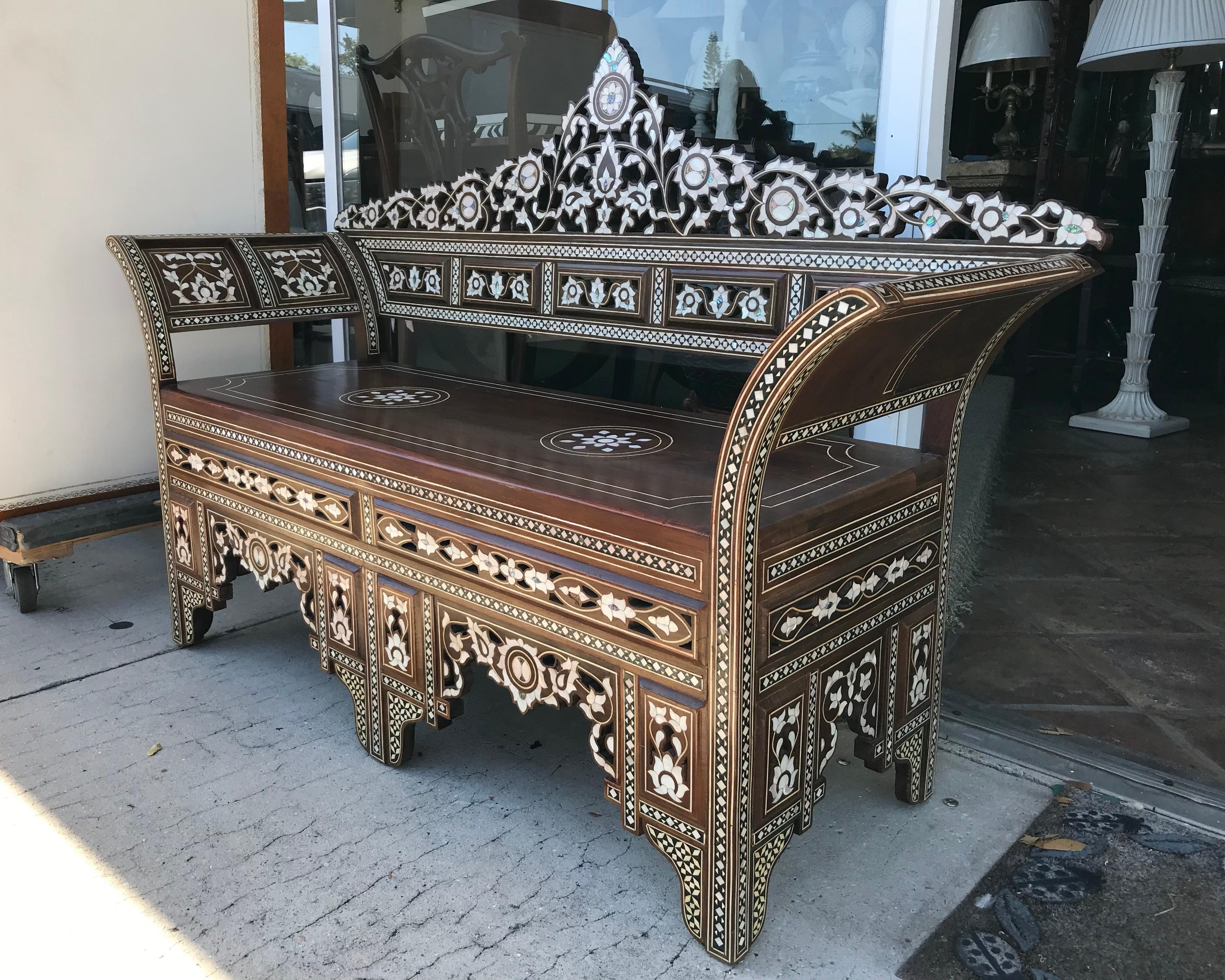 Dramatic in style with fabulous inlay work in camel bone and mother of pearl.
The inlays are extensive and large thruout the front of the piece.
Nicely scaled.