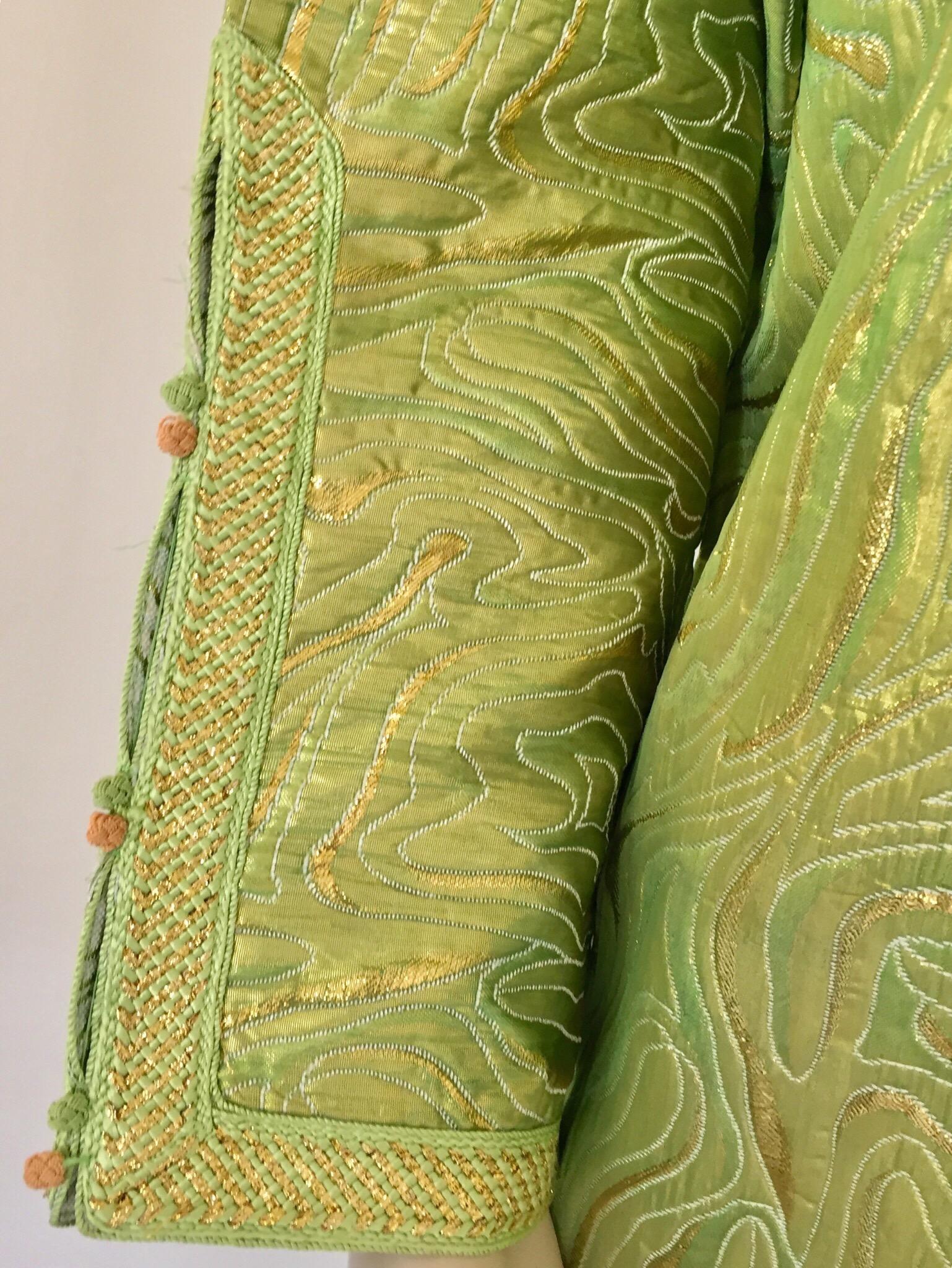 Elegant Moroccan caftan in green and gold lame metallic and embroidered trim,
circa 1970s.
This long maxi dress kaftan is embroidered and embellished entirely by hand.
It’s crafted in Morocco and tailored for a relaxed fit.
One of a kind evening