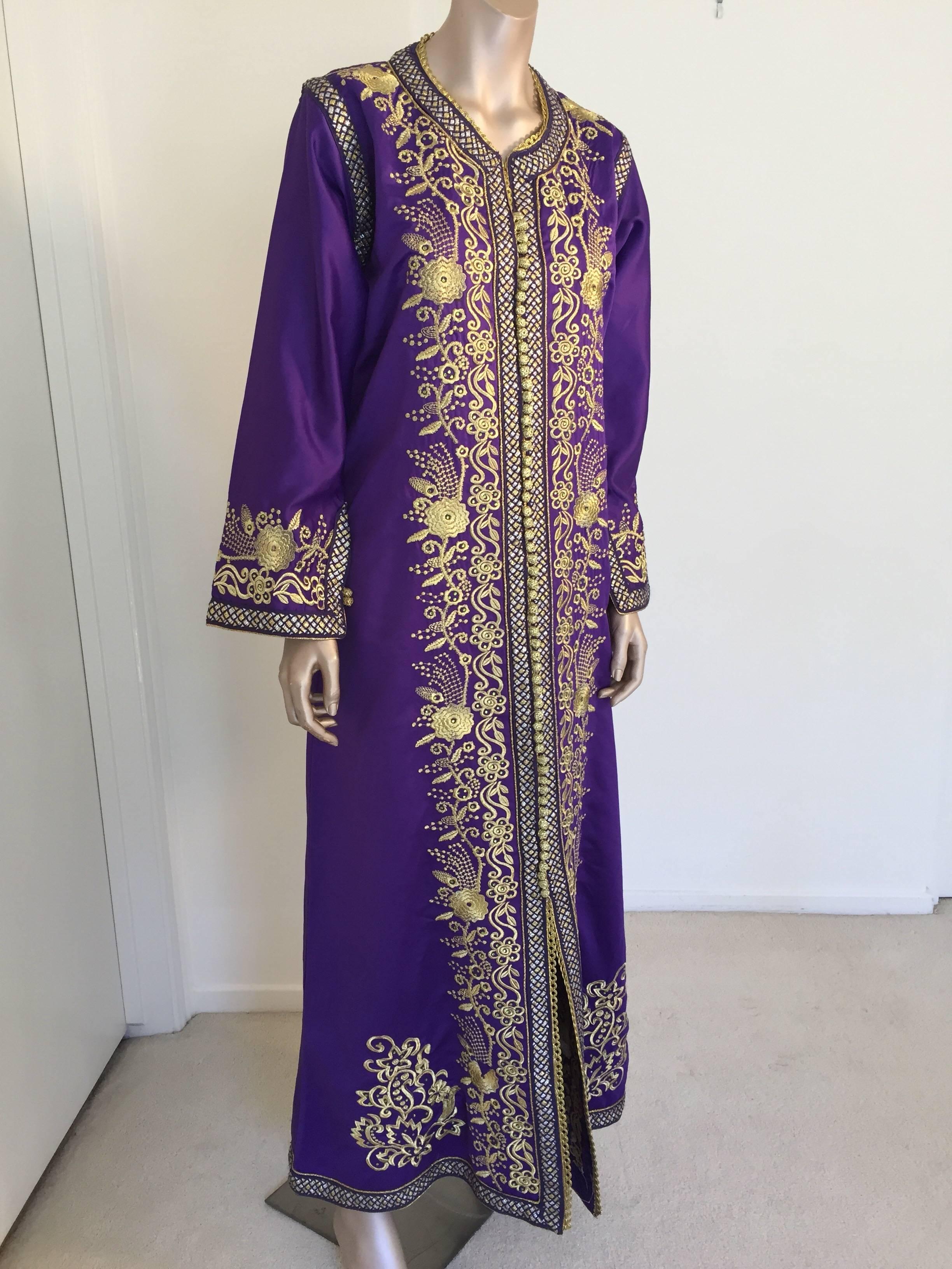 Elegant vintage designer Moroccan kaftan, purple satin embroidered with gold.
This chic Gypsy Bohemian maxi dress kaftan is embroidered and embellished with gold and silver metallic thread. 
One of a kind evening Moroccan Middle Eastern