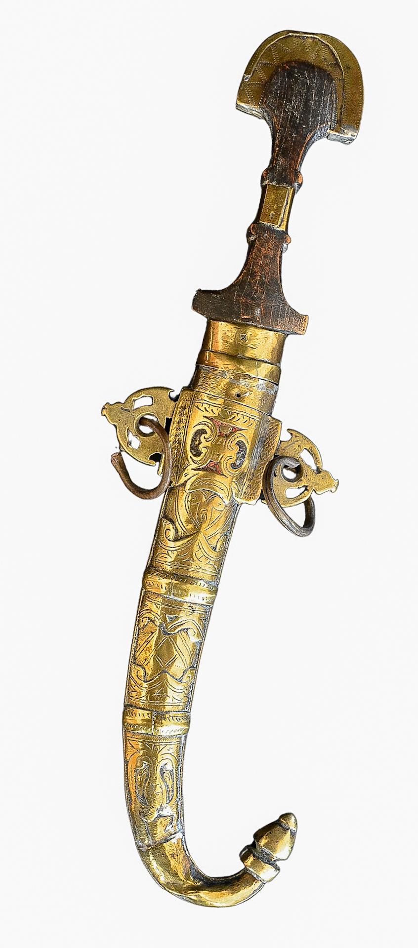 Moroccan Khoumya Tribal hand -crafted and hand-carved dagger with brass scabbard and a chiseled wooden grip.

Hand made by Moroccan artisans and is one-of-a-kind.

Good condition with wear consistent of age and use. Measuring 15 inches L. x 4 inches
