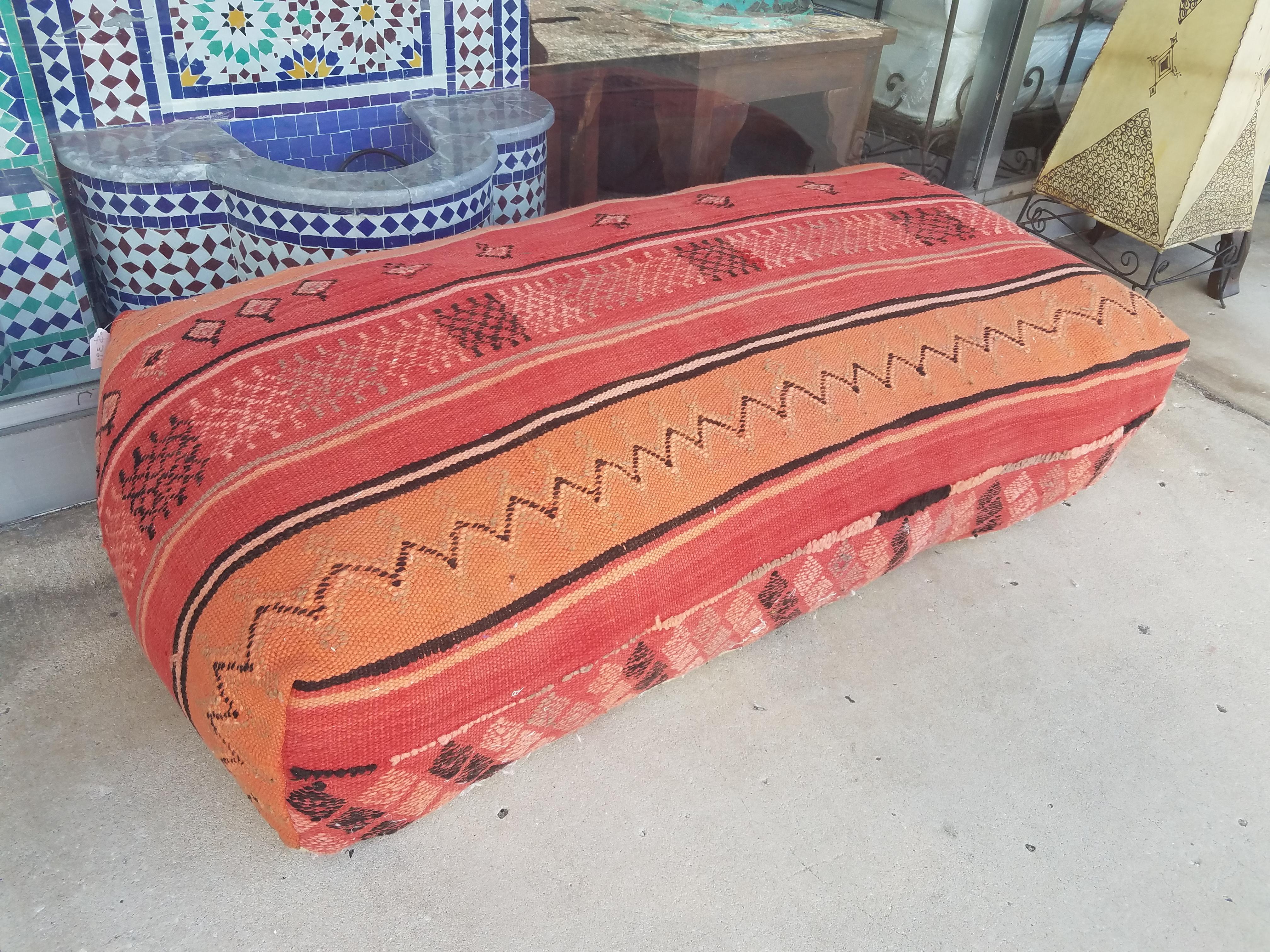 Special and rare double seating Moroccan Hanbal pouf made from re-purposed Moroccan Kilims, all of them Berber vintage, measuring approximately 50