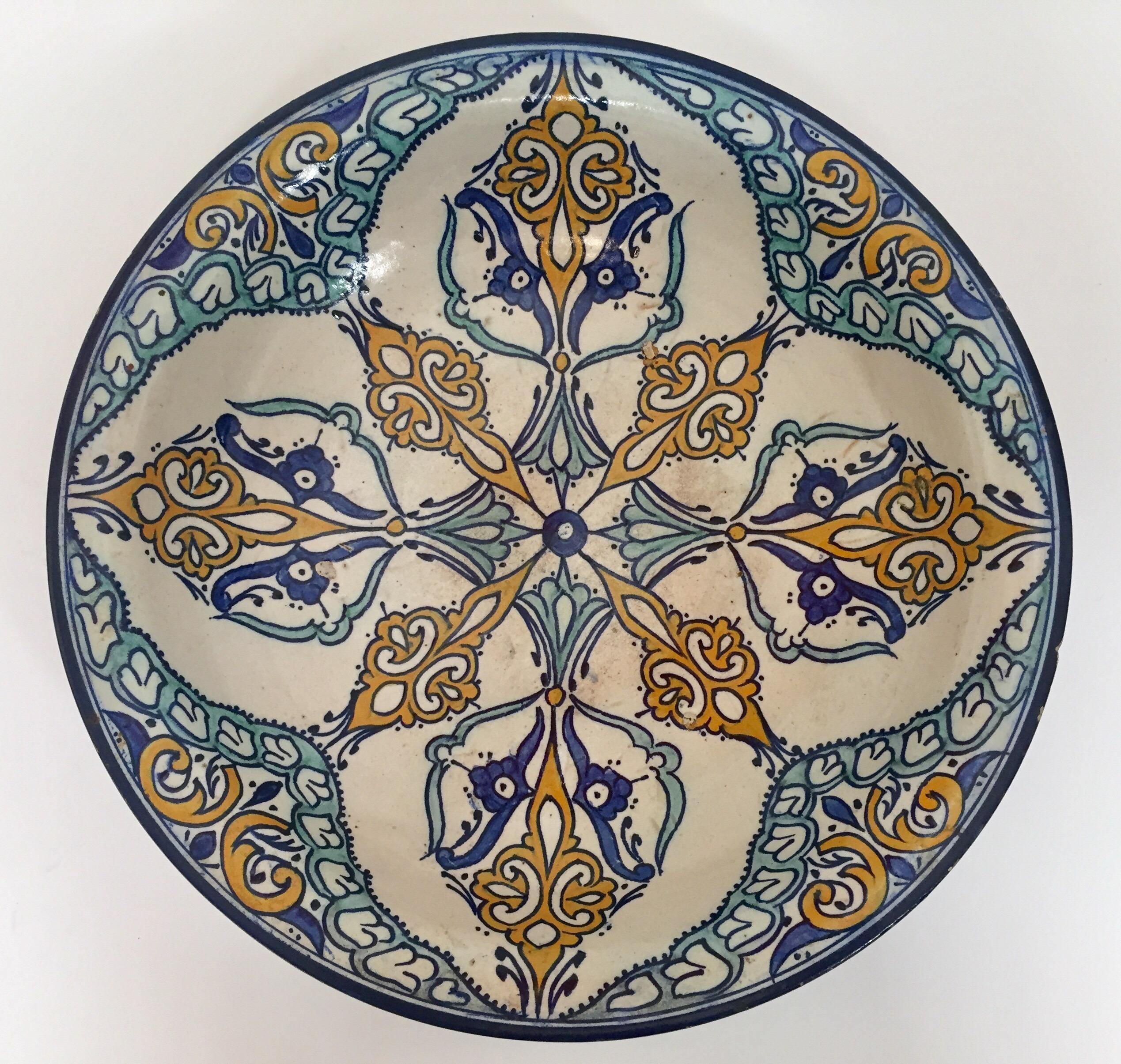 Large Moroccan ceramic bowl handcrafted in Fez by artisans.
Hand painted Moorish ceramic plate from Fez Morocco.
This kind of Moorish Spanish style ceramic artwork could be found at the Alhambra palace in Granada Spain.
Turquoise, blue, safran