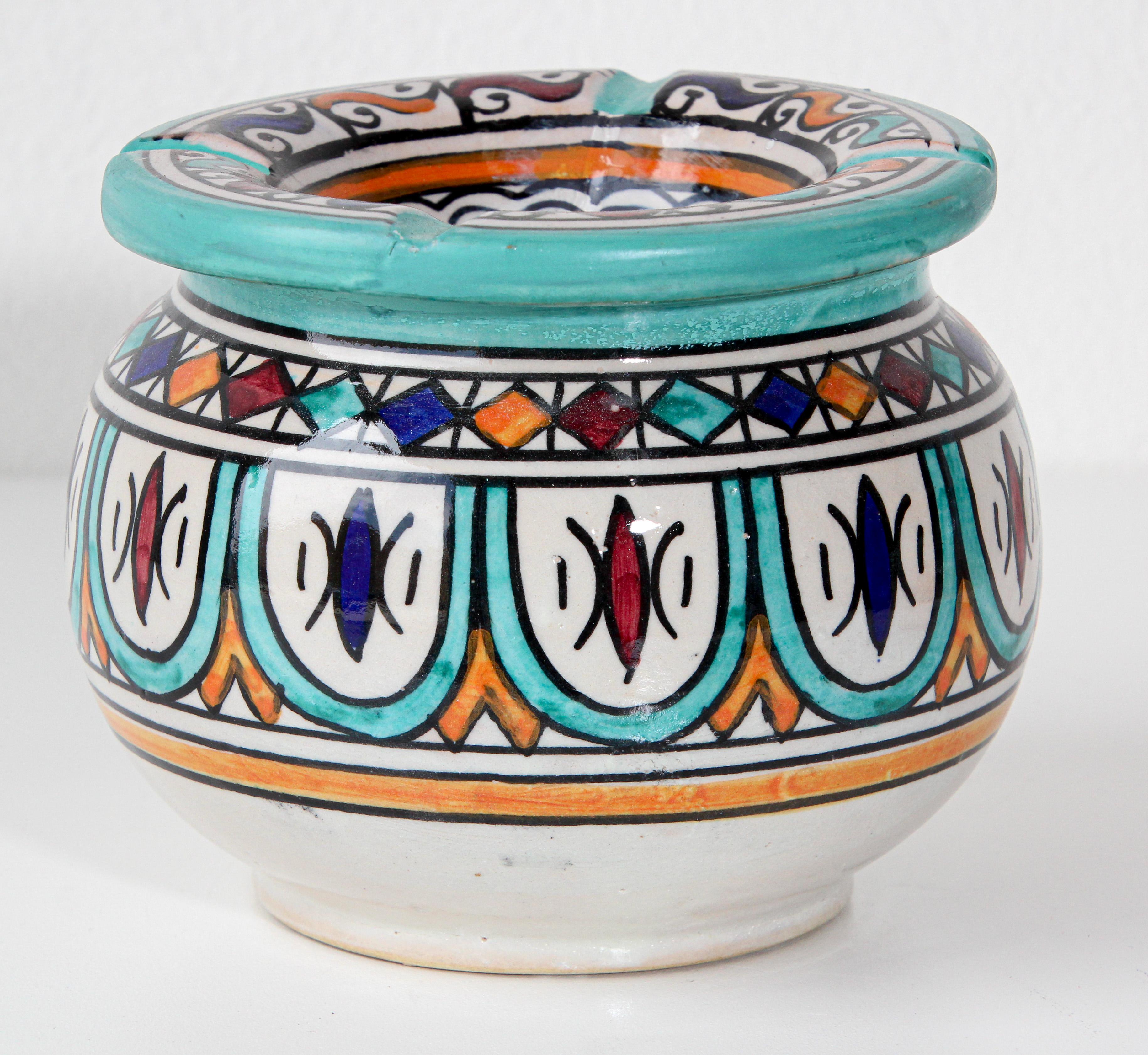 Moroccan covered hand painted ceramic ashtray.
Handcrafted Moroccan ceramic covered ash receiver.
This covered ashtray could be used indoor and outdoor.
If used indoor the cover will keep the smell of ashes in.
hand painted with Moorish designs