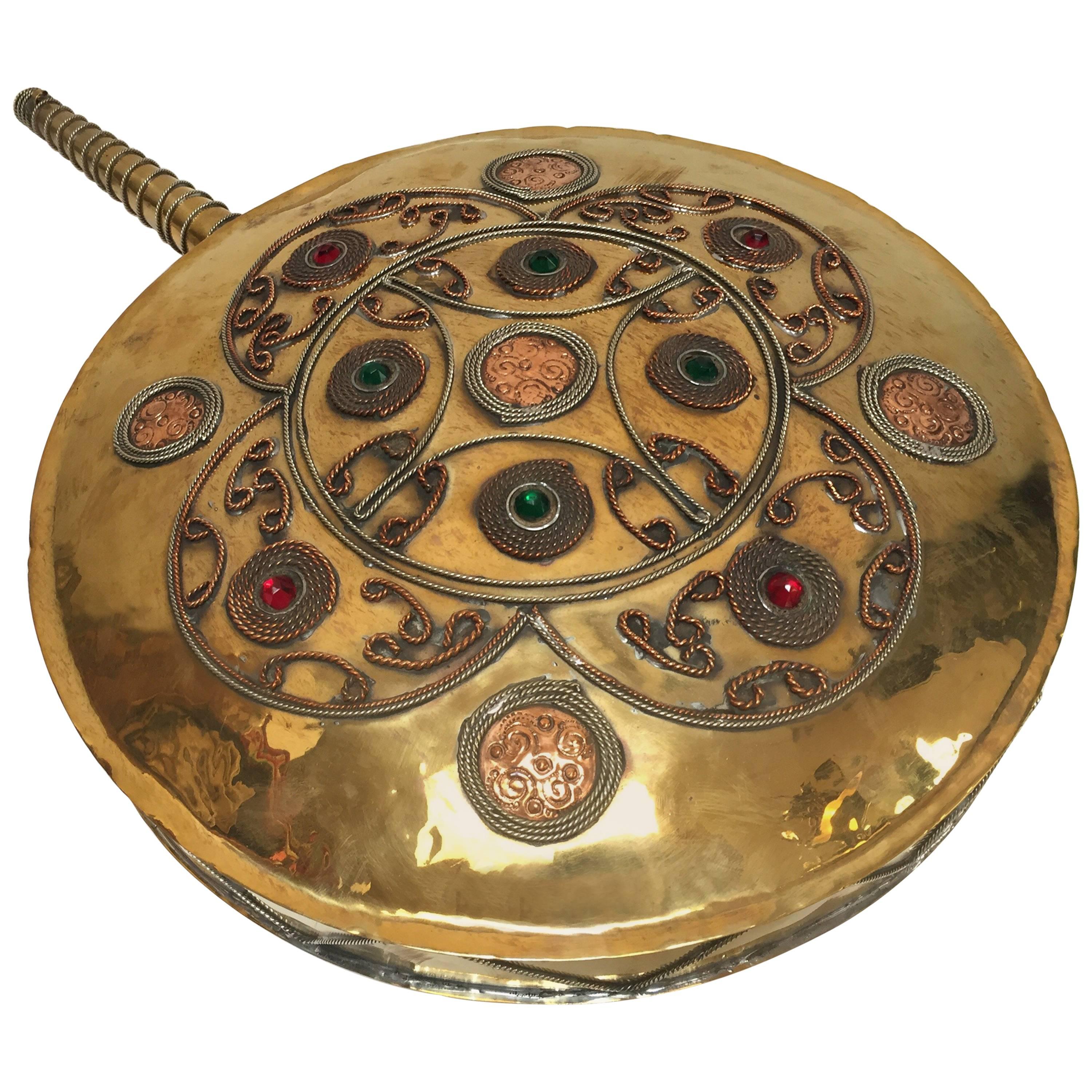 Moroccan antique tribal drinking flask gunpowder large brass flask polished and decorated with semi precious glass stones and filigree metal. 
Huge antique copper and brass decorative bottle, flask wall hanging sculpture.
Large brass circular