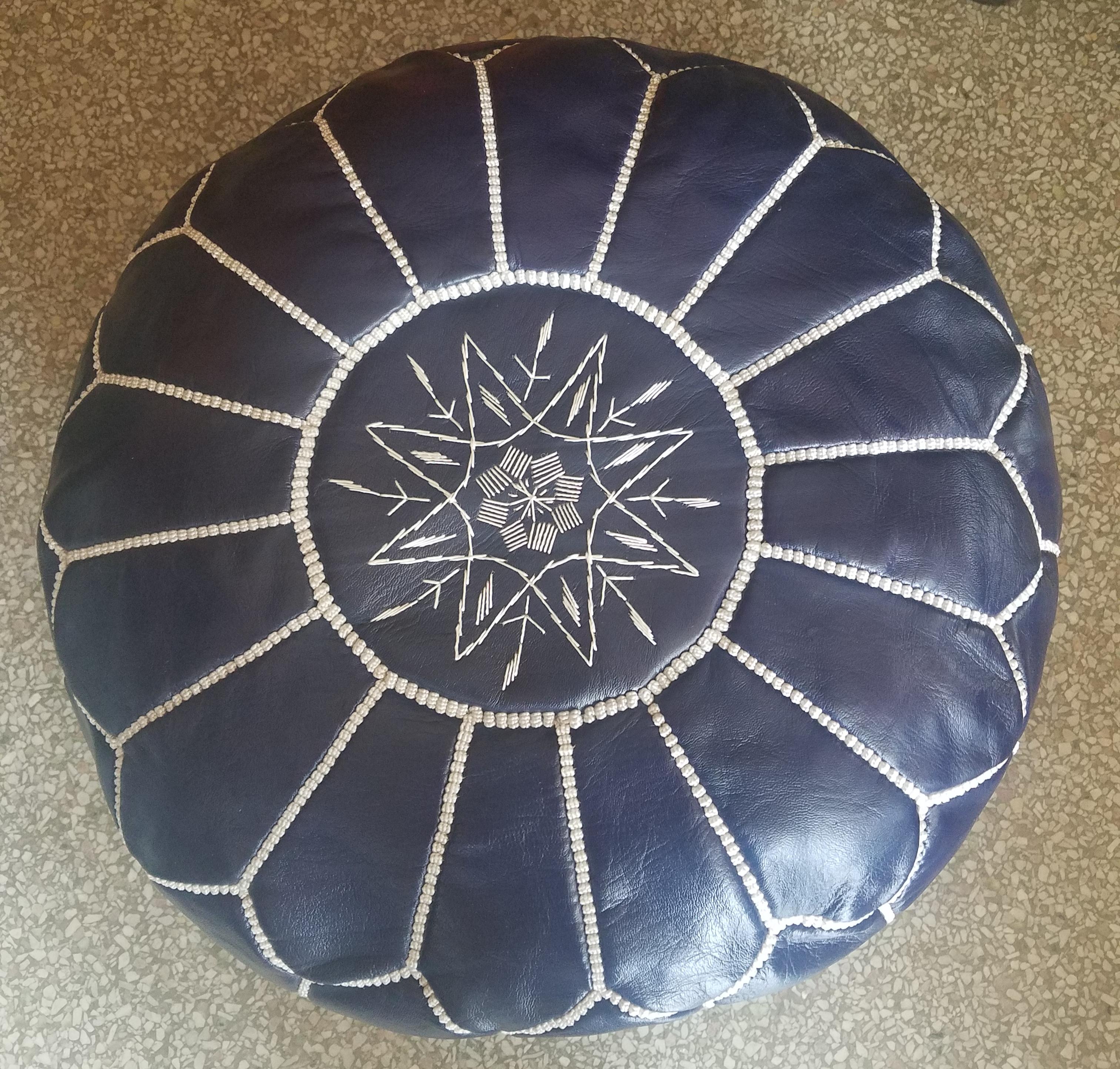 navy leather pouf