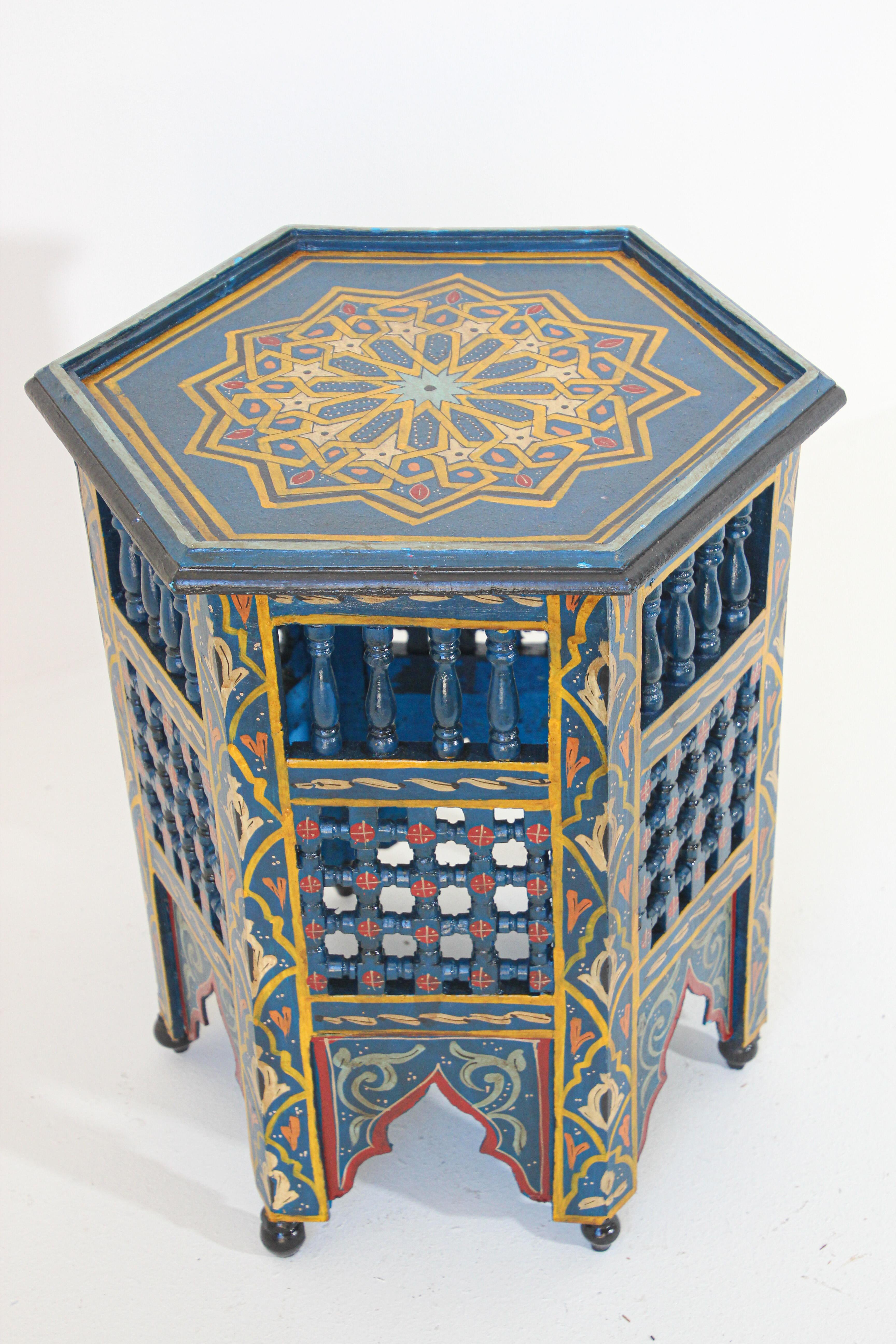 Moroccan Moorish blue handcrafted and hand painted side table.
Moucharabie fret work octagonal stool with Moorish arches.
Handcrafted in Hispano Moresque style and hand painted on blue color background with wine, aqua, green and ochre Moorish