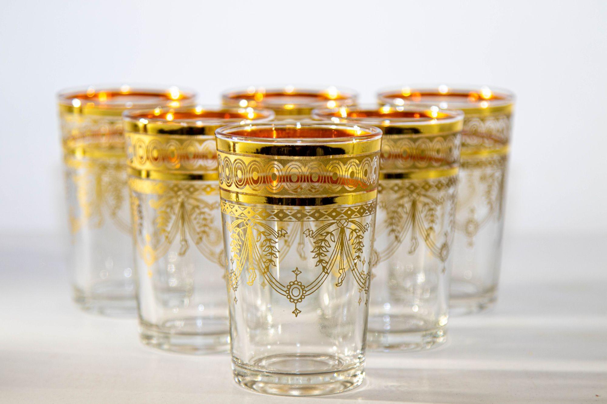 Moroccan Moorish glasses with gold design set of six.
Set of six Moorish drinking glasses with gold raised overlay design.
Set of tumblers, decorated with an intricate gold motif of ribbon and floral garlands.
Decorated with a gold pattern Moorish