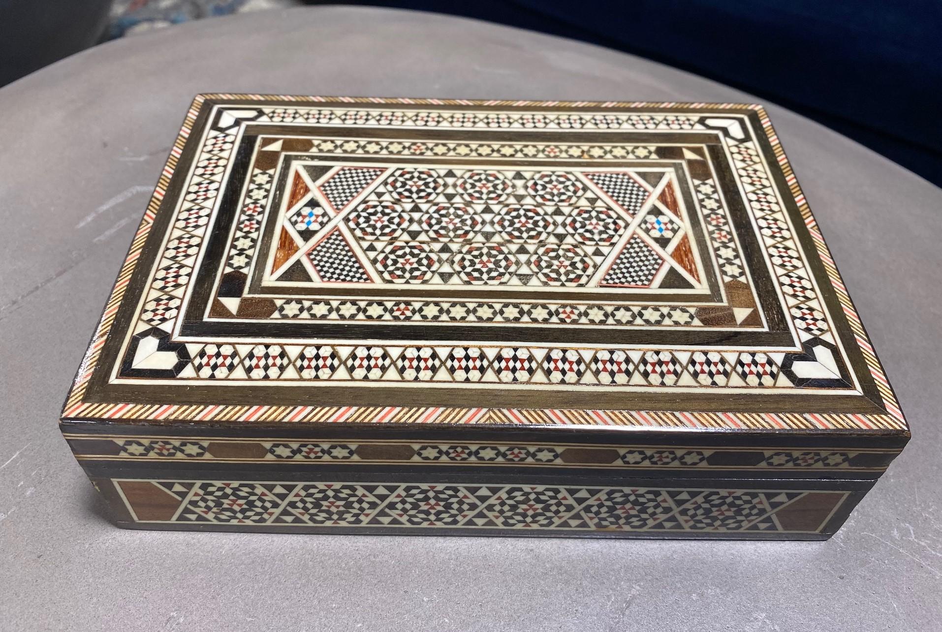 Stunning mosaic design, this intricate wood box is made from multiple micro pieces of wood with some possible bone inlays. Gorgeous craftsmanship. A true work of art. 

Would be a great addition to any decorative art box or jewelry box collection