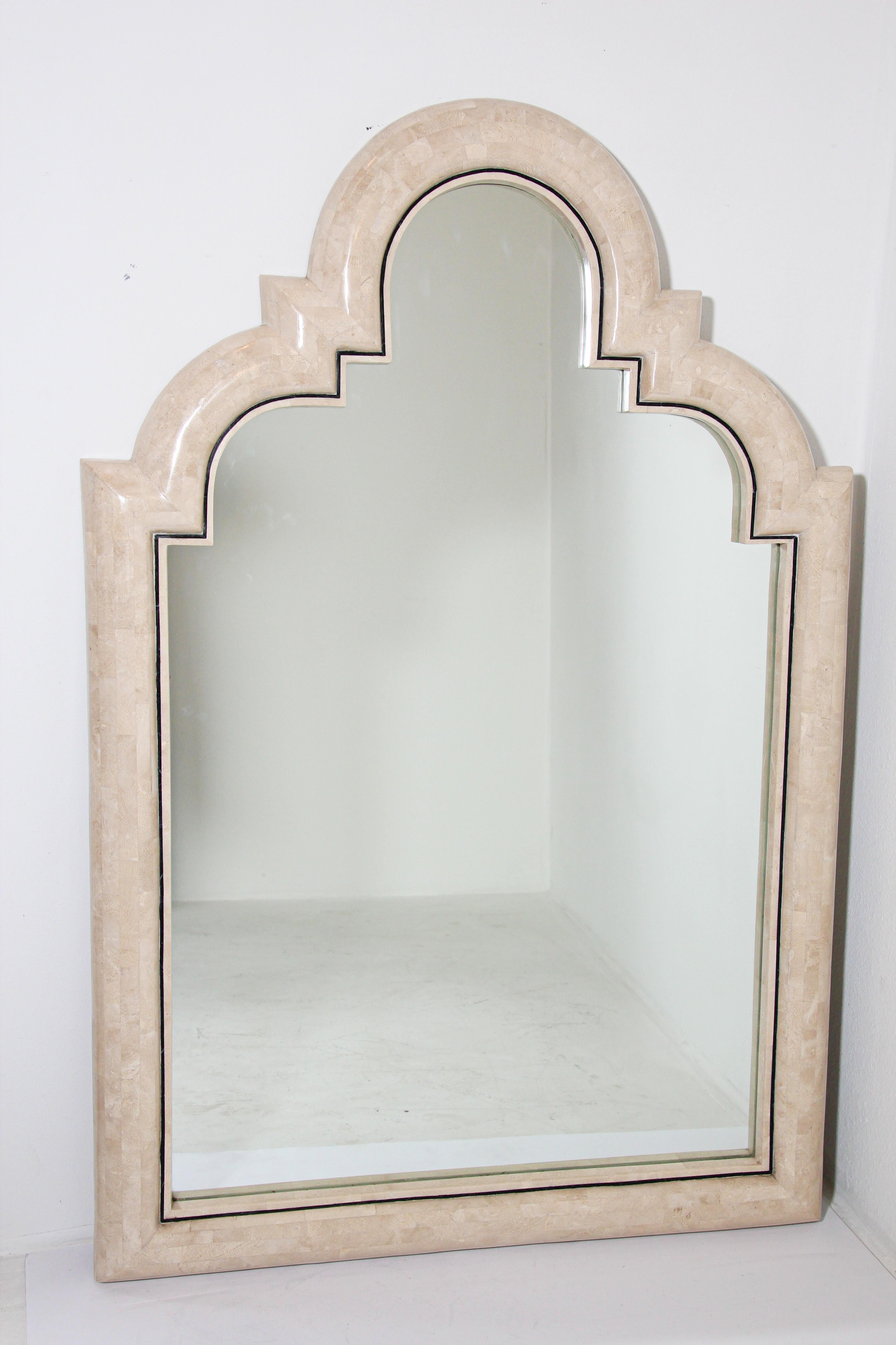 Moroccan Moorish mirror tessellated marble stone by Maitland Smith.
Monumental Moroccan style mirror by Maitland Smith, tessellated marble stone with Moorish arched.
Arched mirror frame veneered Tessellated stone mirror with white vanilla colored