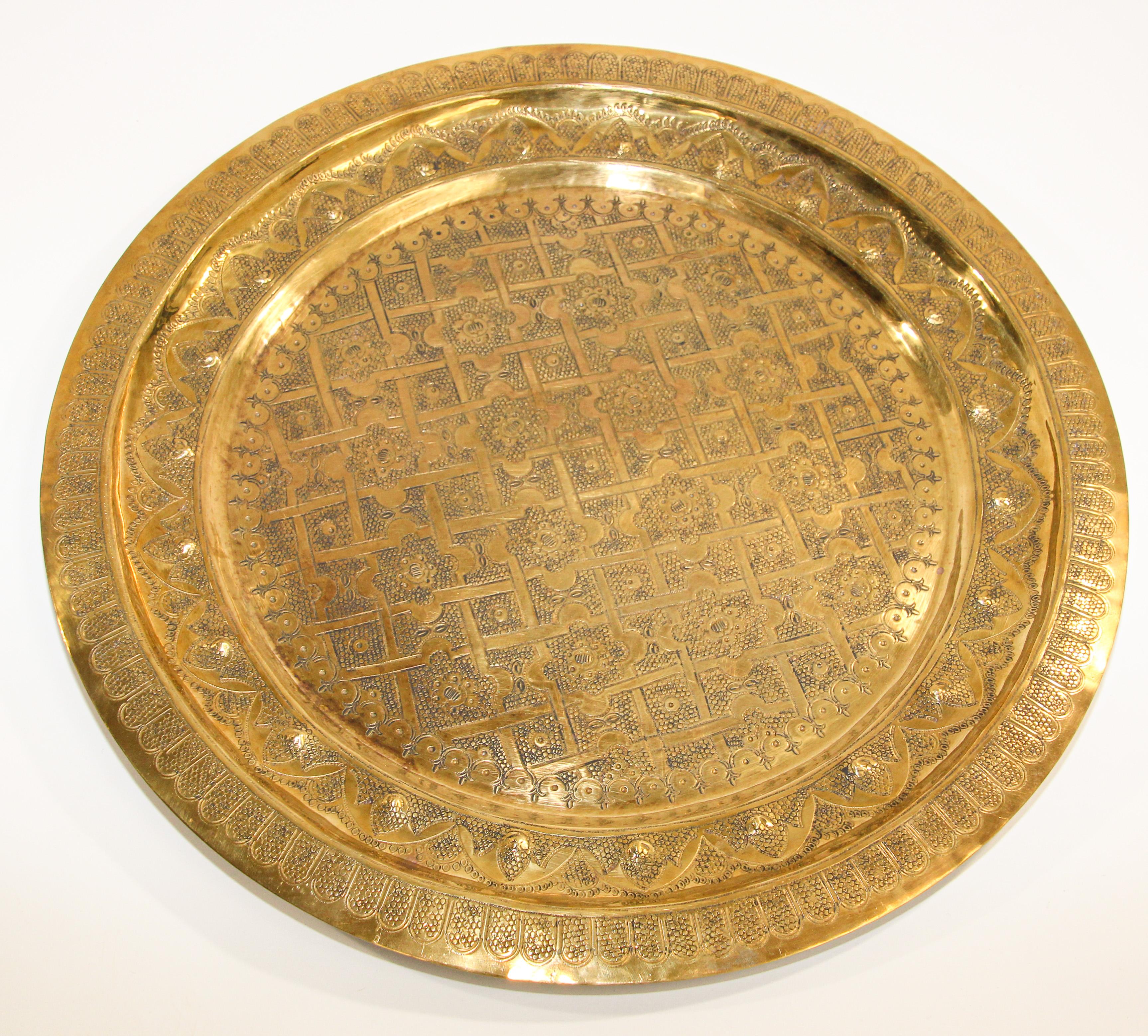 Fabulous Moroccan Moorish hand-hammered brass tray, intricate multi dimension artwork, very fine Islamic Metalwork brass repousse geometrical designs.
Handcrafted decorative brass tray, could be used also as a serving platter, or an ottoman, or as