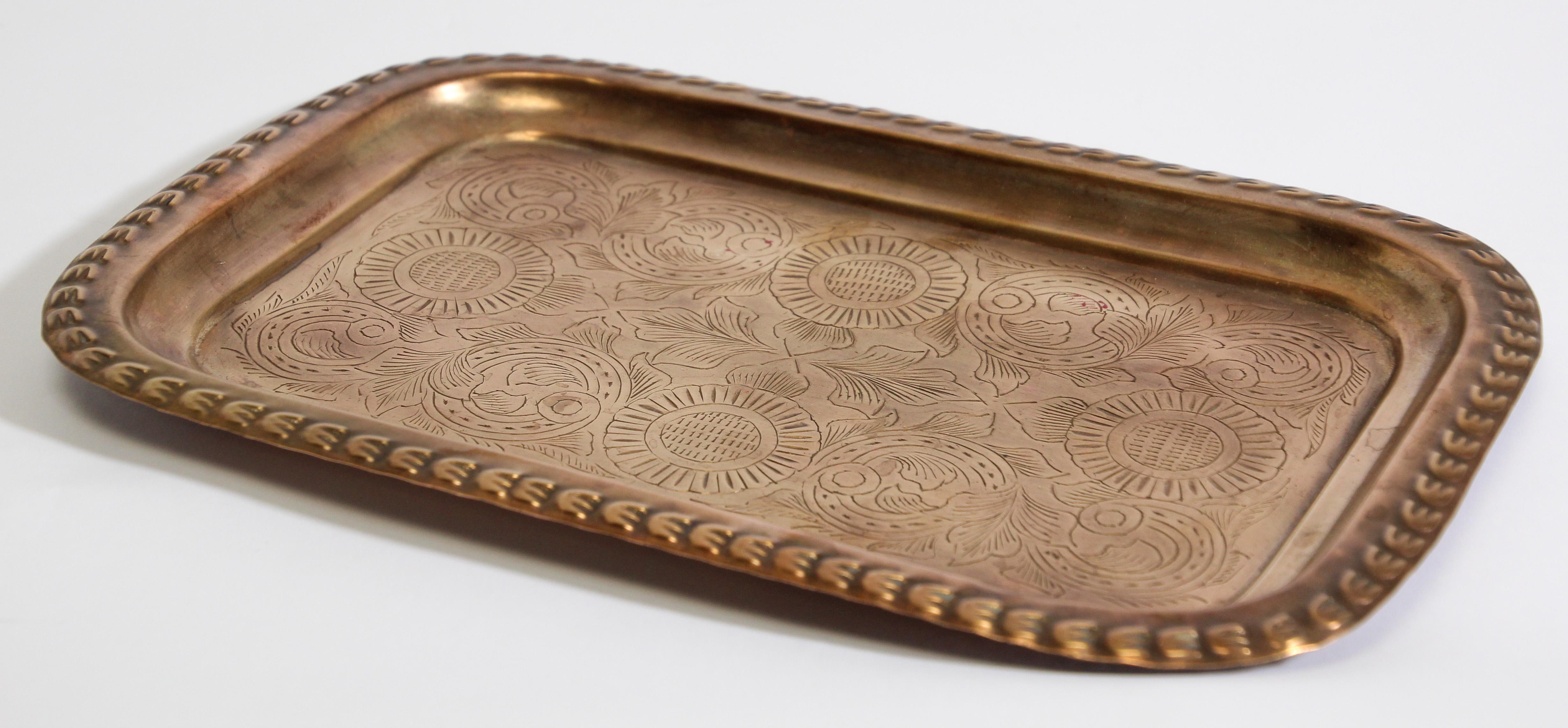 Handcrafted Moroccan Moorish rectangular brass tray hammered with fine delicate geometrical and floral designs.
Could be used as a serving tray platter.
Handmade in Morocco.
Dimensions: 8