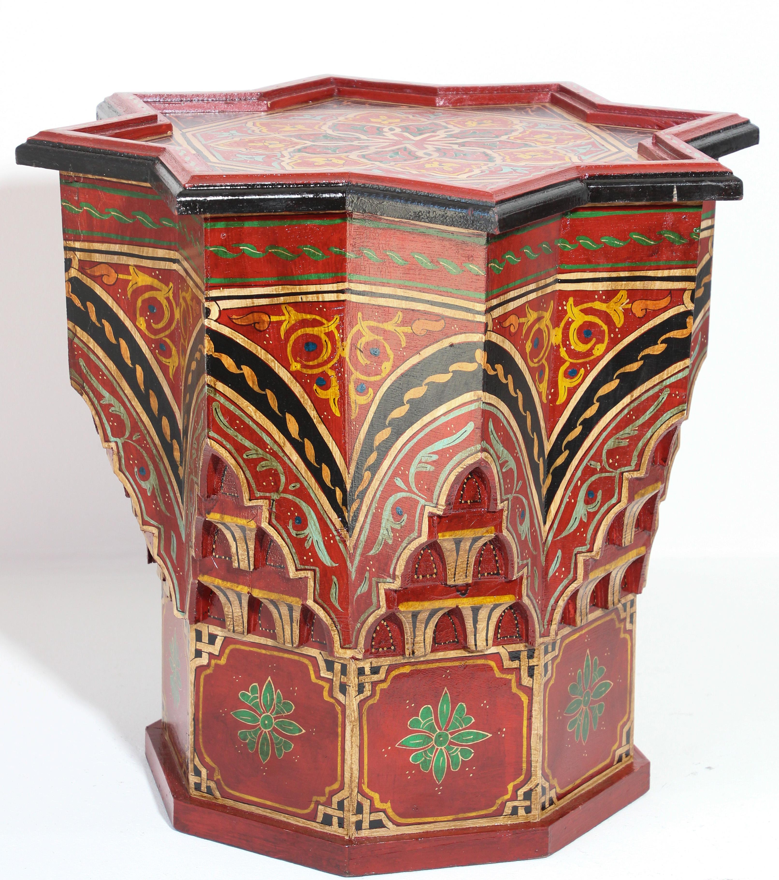 Moroccan colorful red hand painted and carved side occasional table with Moorish Islamic designs.
Pedestal table in red background with multicolored floral and geometric designs.
Very decorative fine artwork on a star shape base.
Hand painted in