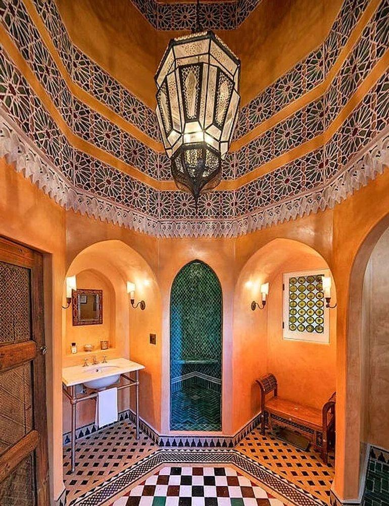 Moroccan Moorish vintage clear glass with intricate metal filigree hanging chandelier.
You can see in the second picture one of our light fixture which was used in a Bathroom at Madonna home in Hollywood Hills California.
Rewired with a cluster of