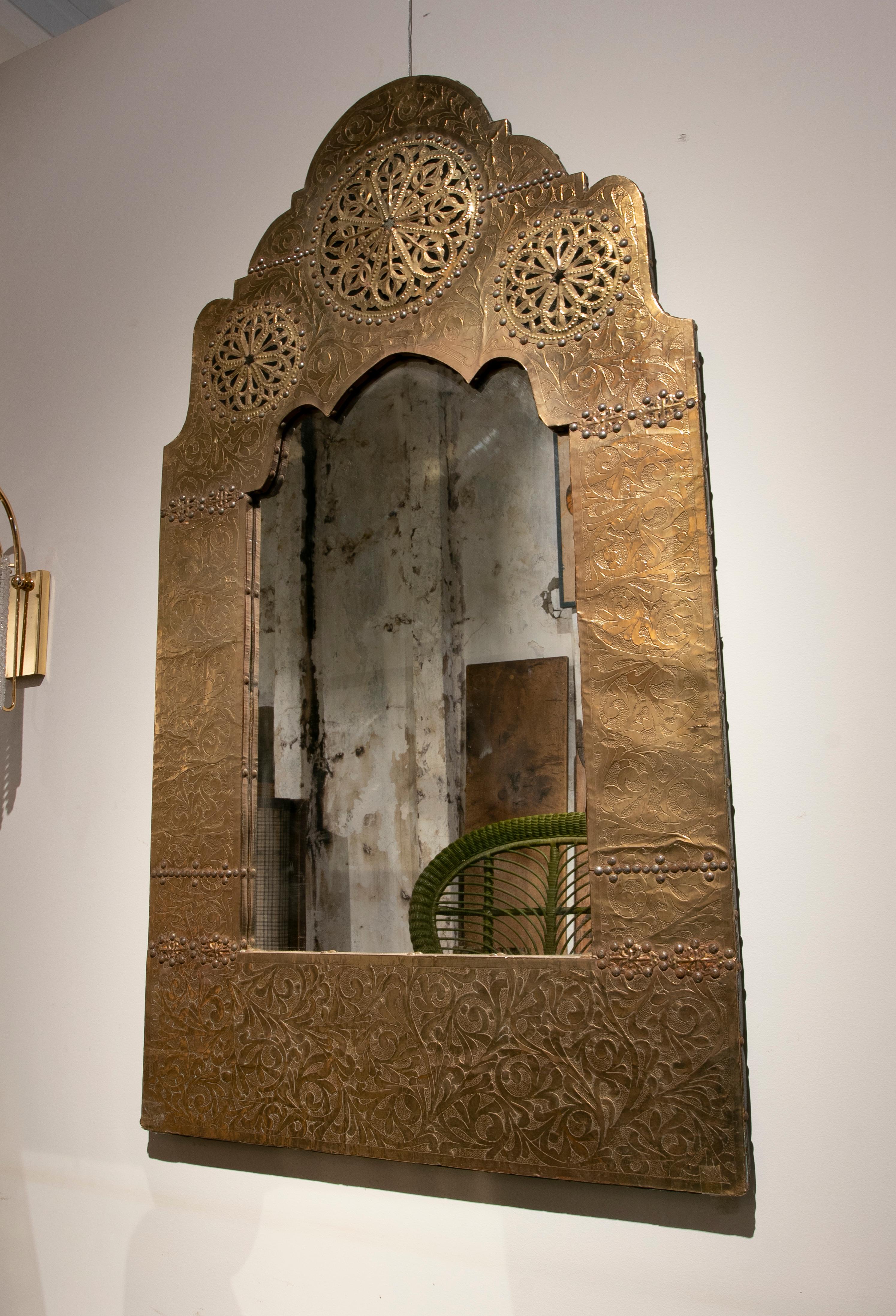 Moroccan pair of brass hand carved wall mirrors.