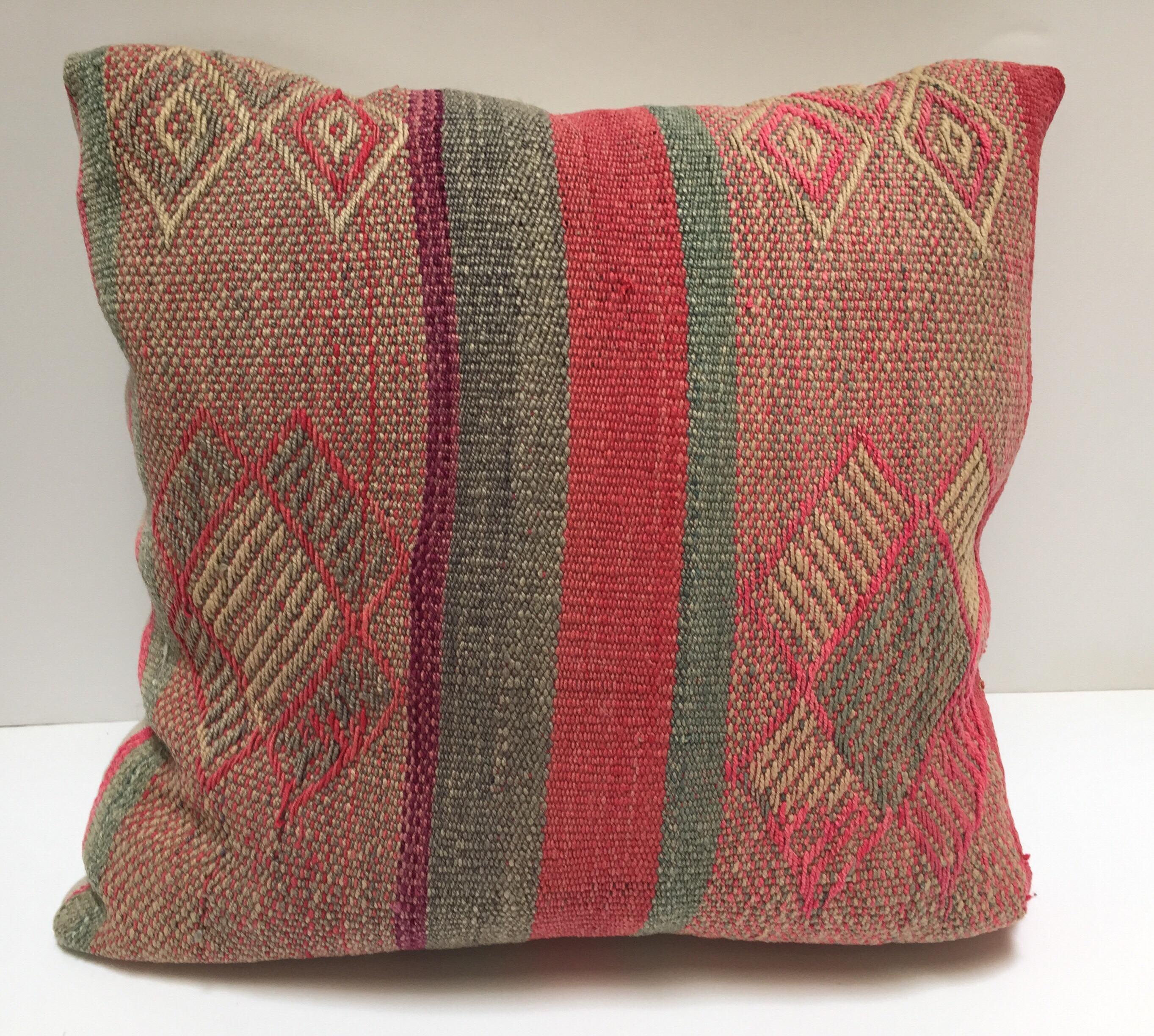 Great Bohemian hippie chic stylish Moroccan tribal throw pillows. 
Made from traditional Moroccan Berber handwoven pastel colors Kilim blanket.
This tribal pillow feature stripes in aqua blue, pinks with geometric designs. 
Add the Gypsy hippie chic